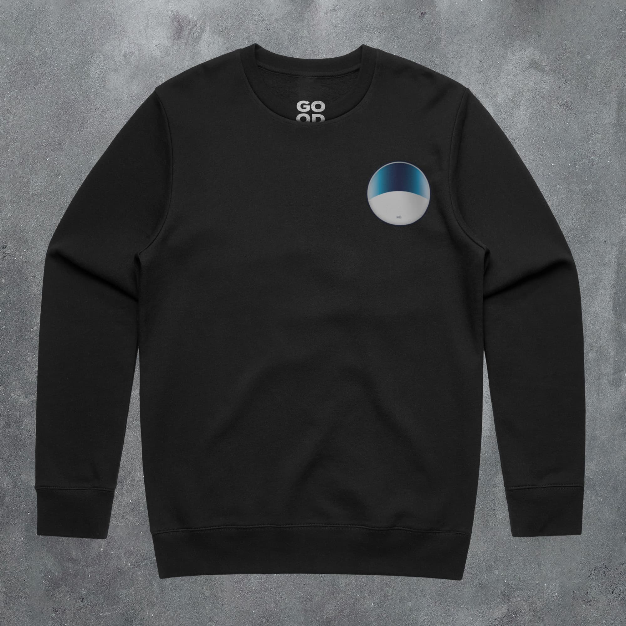 a black sweatshirt with a blue and white circle on it