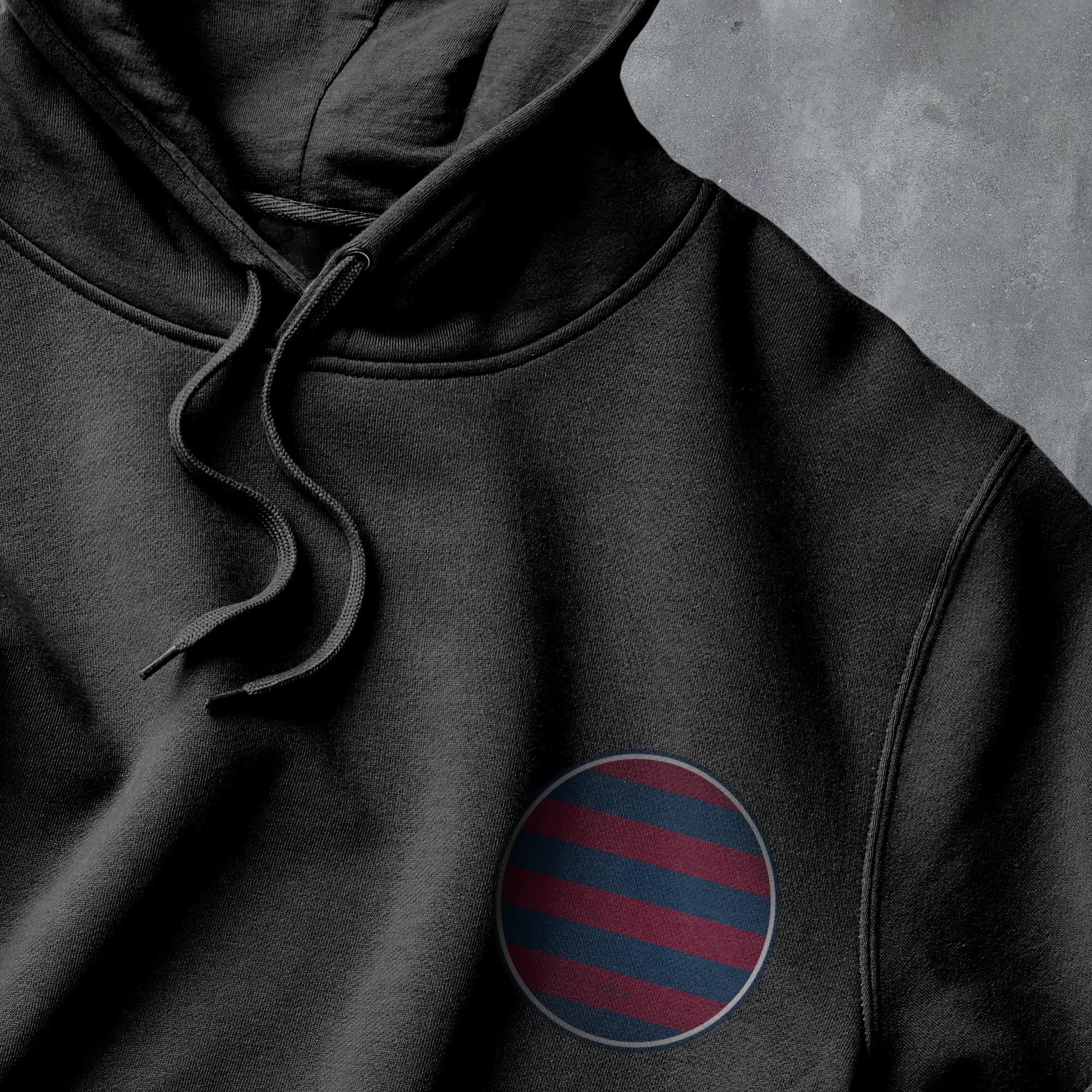 a black hoodie with a red and blue stripe on it