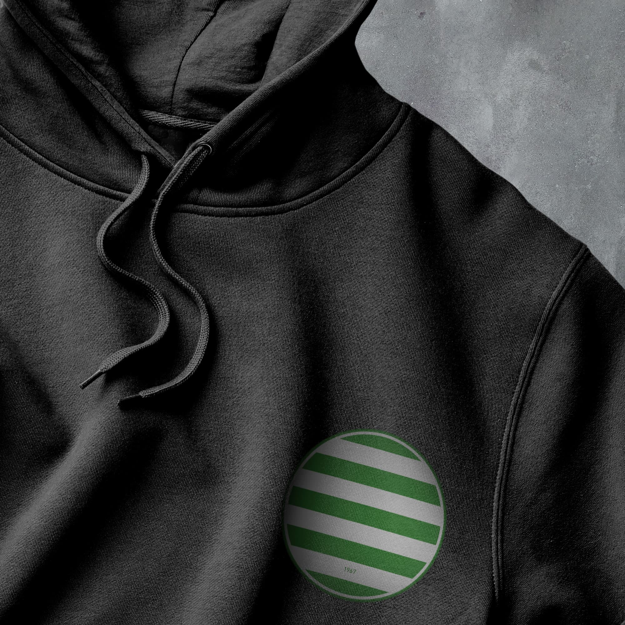 a black hoodie with a green and white striped circle on it