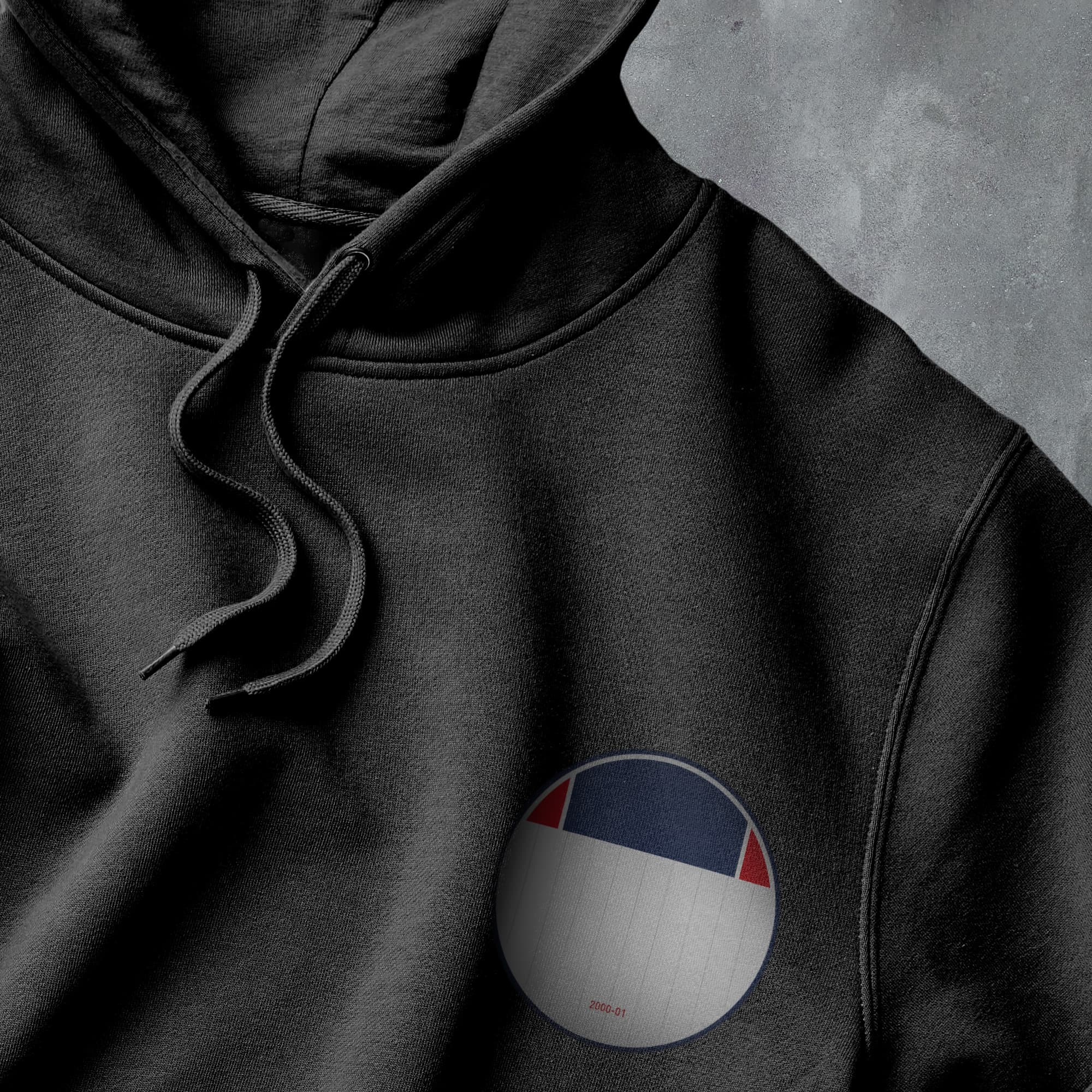 a black hoodie with a red, white, and blue patch on it