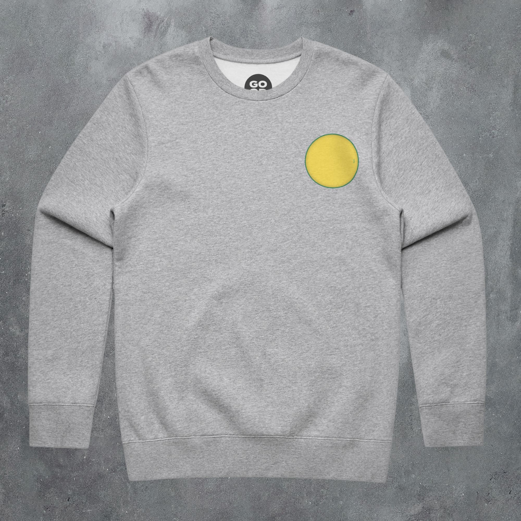 a grey sweatshirt with a yellow circle on it