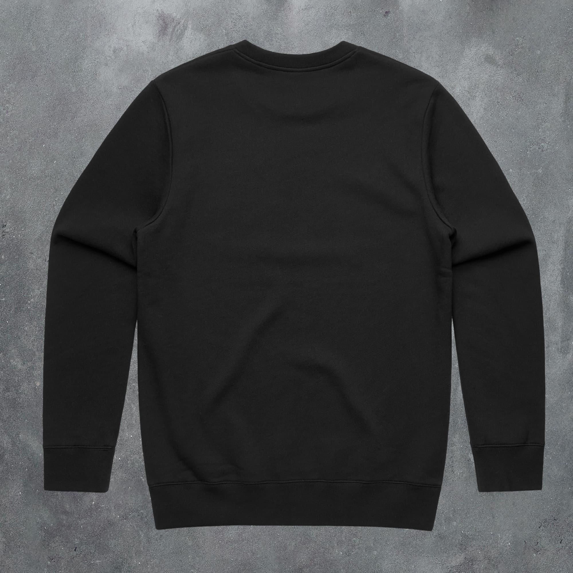 a black sweatshirt on a concrete background