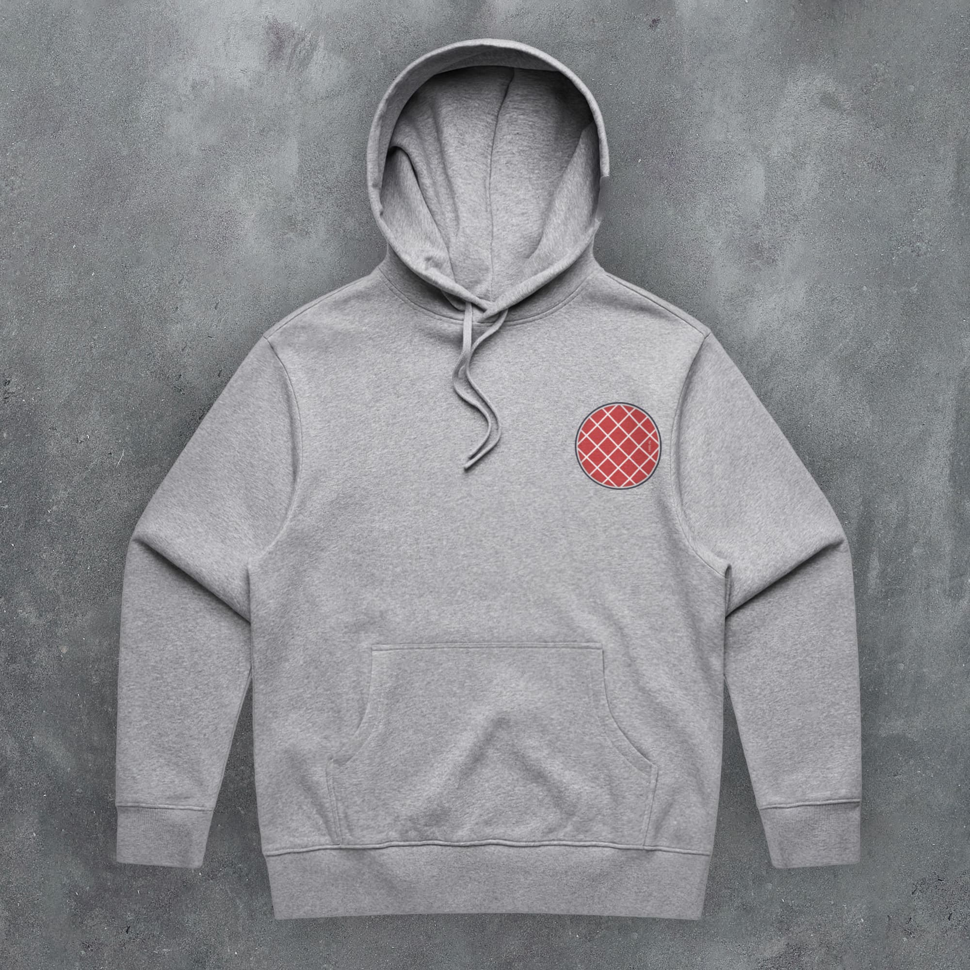 a grey hoodie with a red checkered patch on it