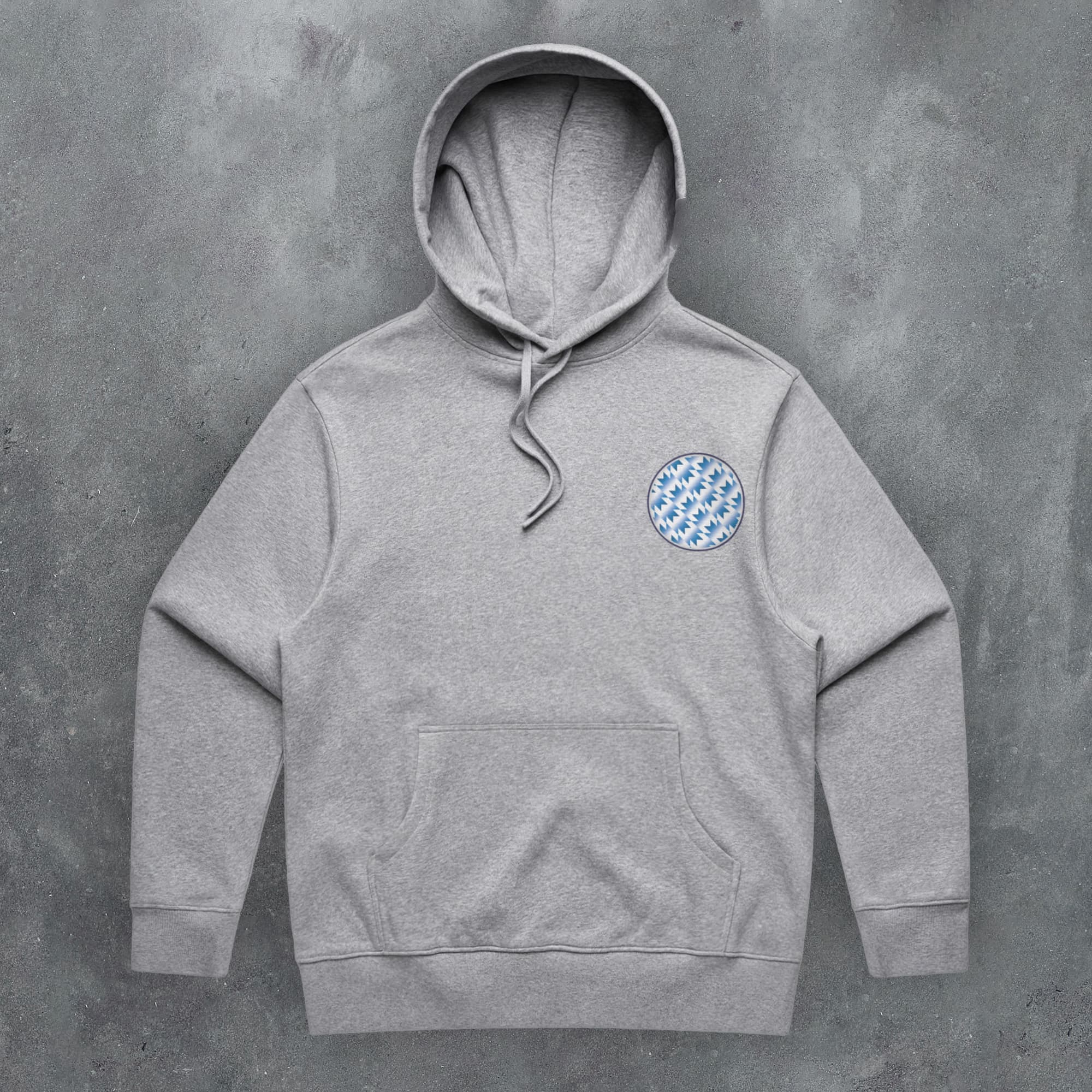 a grey hoodie with a checkered patch on the front