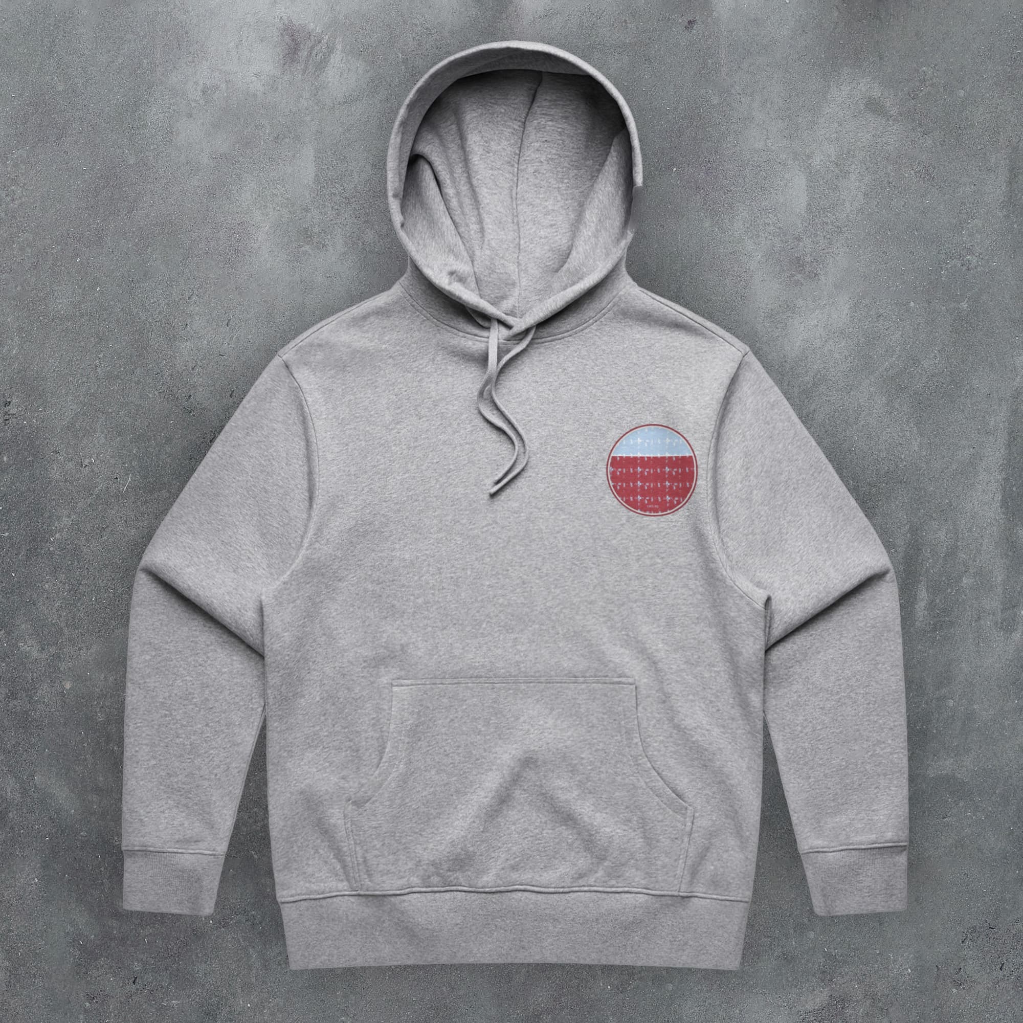 a grey hoodie with a red circle on it