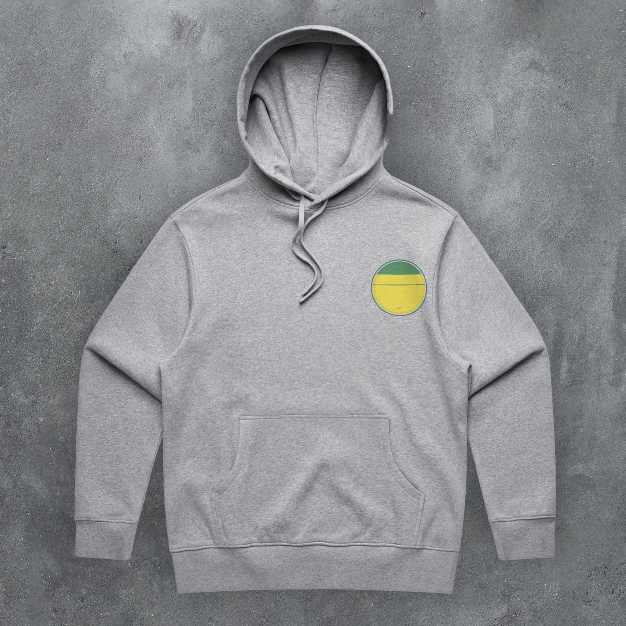 a grey hoodie with a yellow circle on it