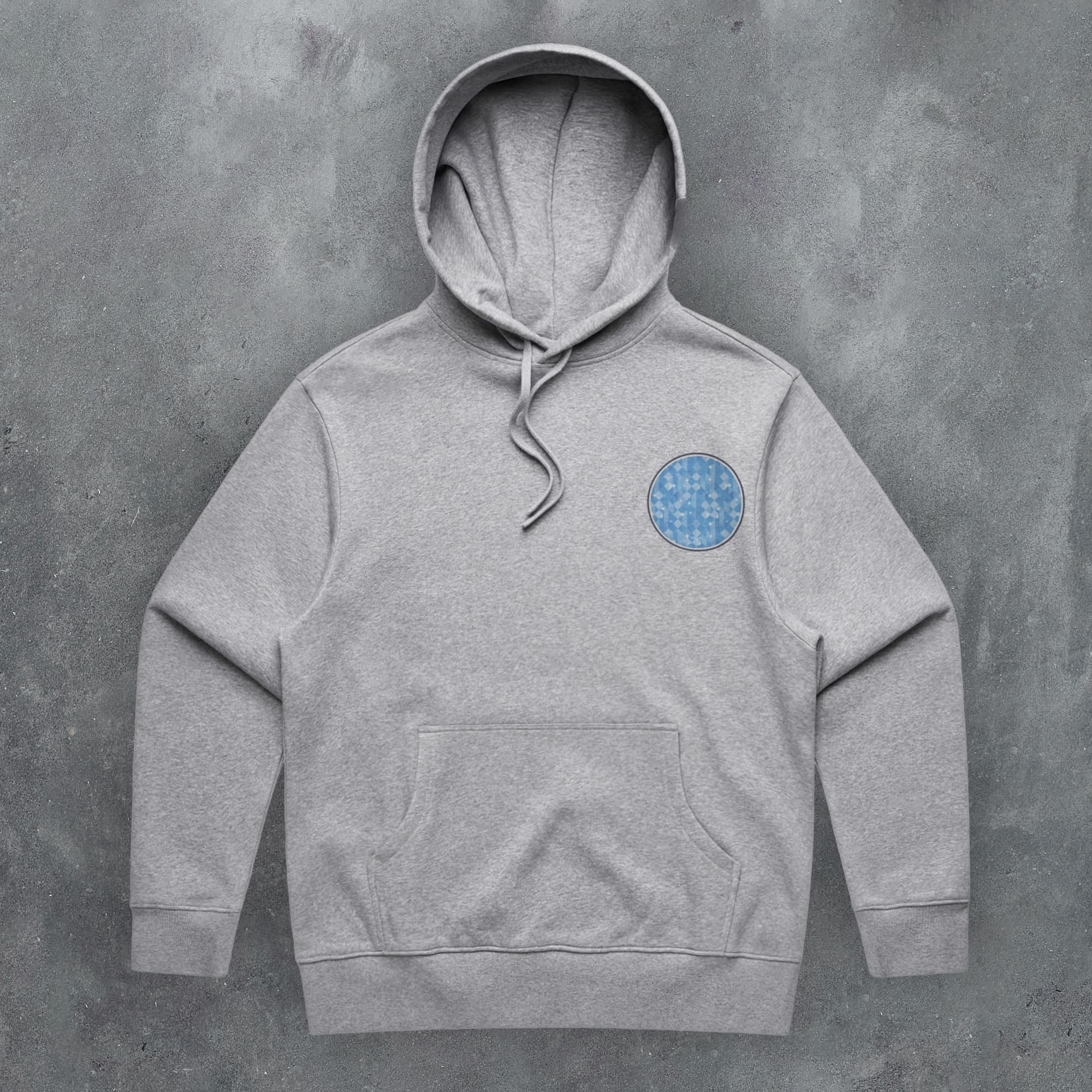 a grey hoodie with a blue circle on it