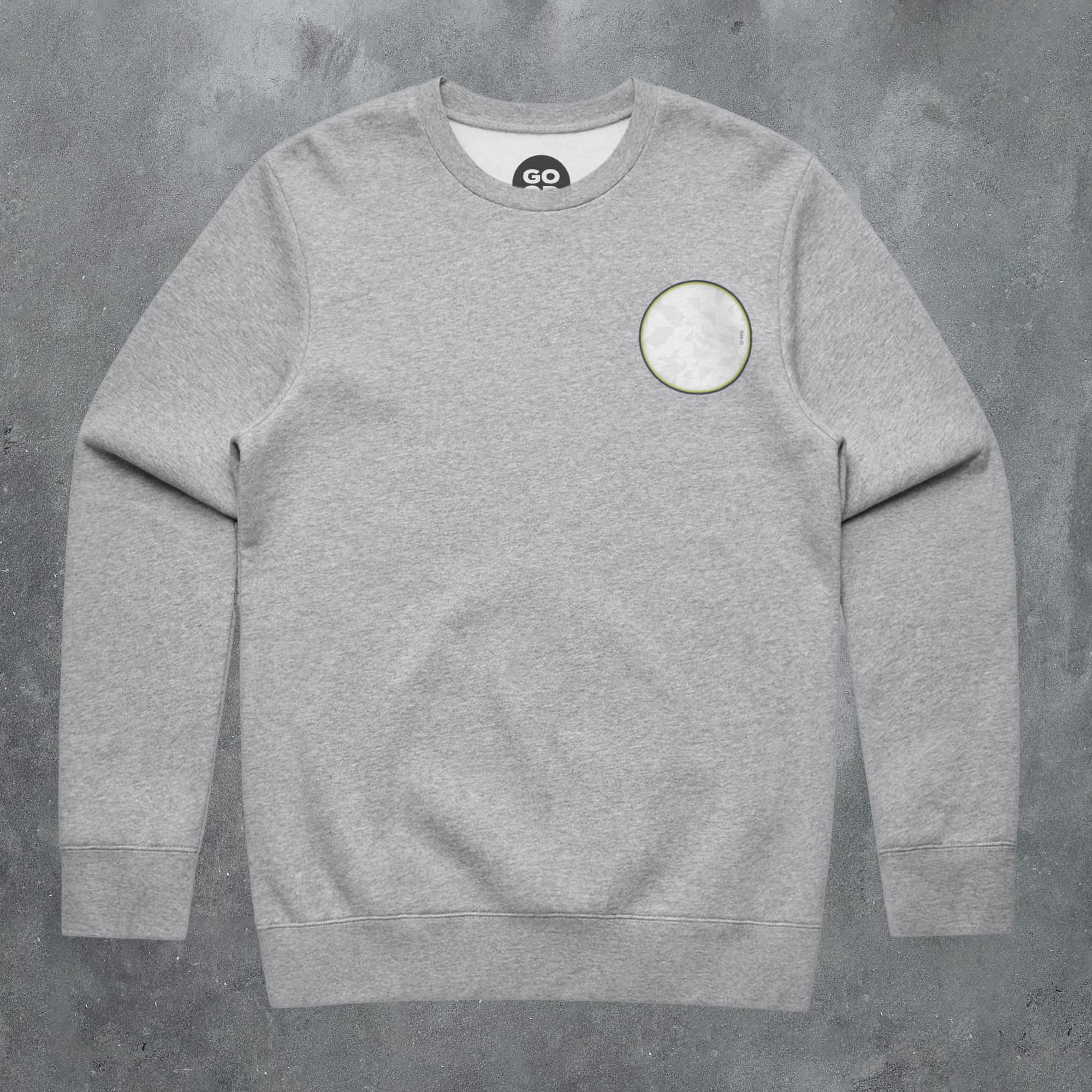 a grey sweatshirt with a white circle on it