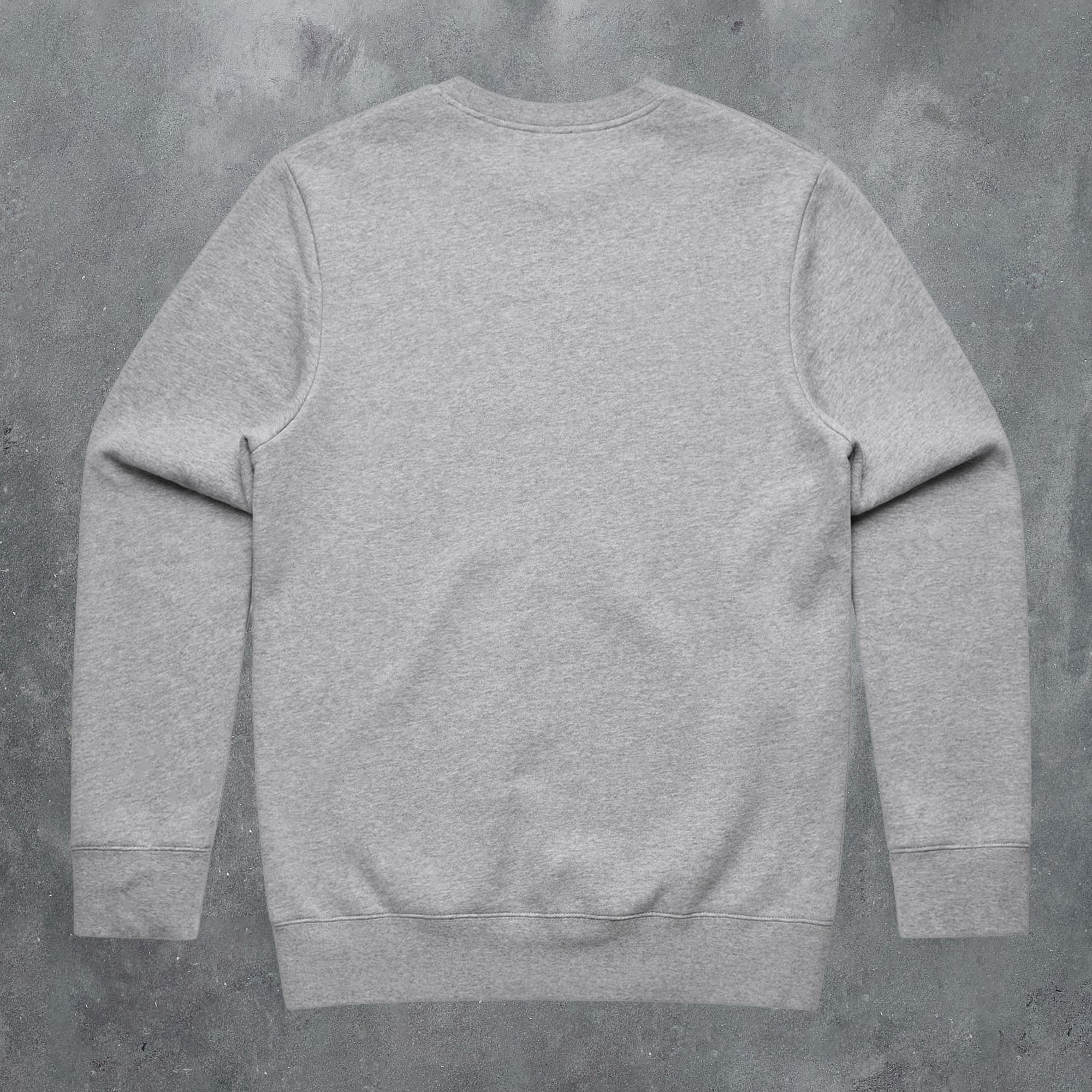 a grey sweatshirt on a concrete background