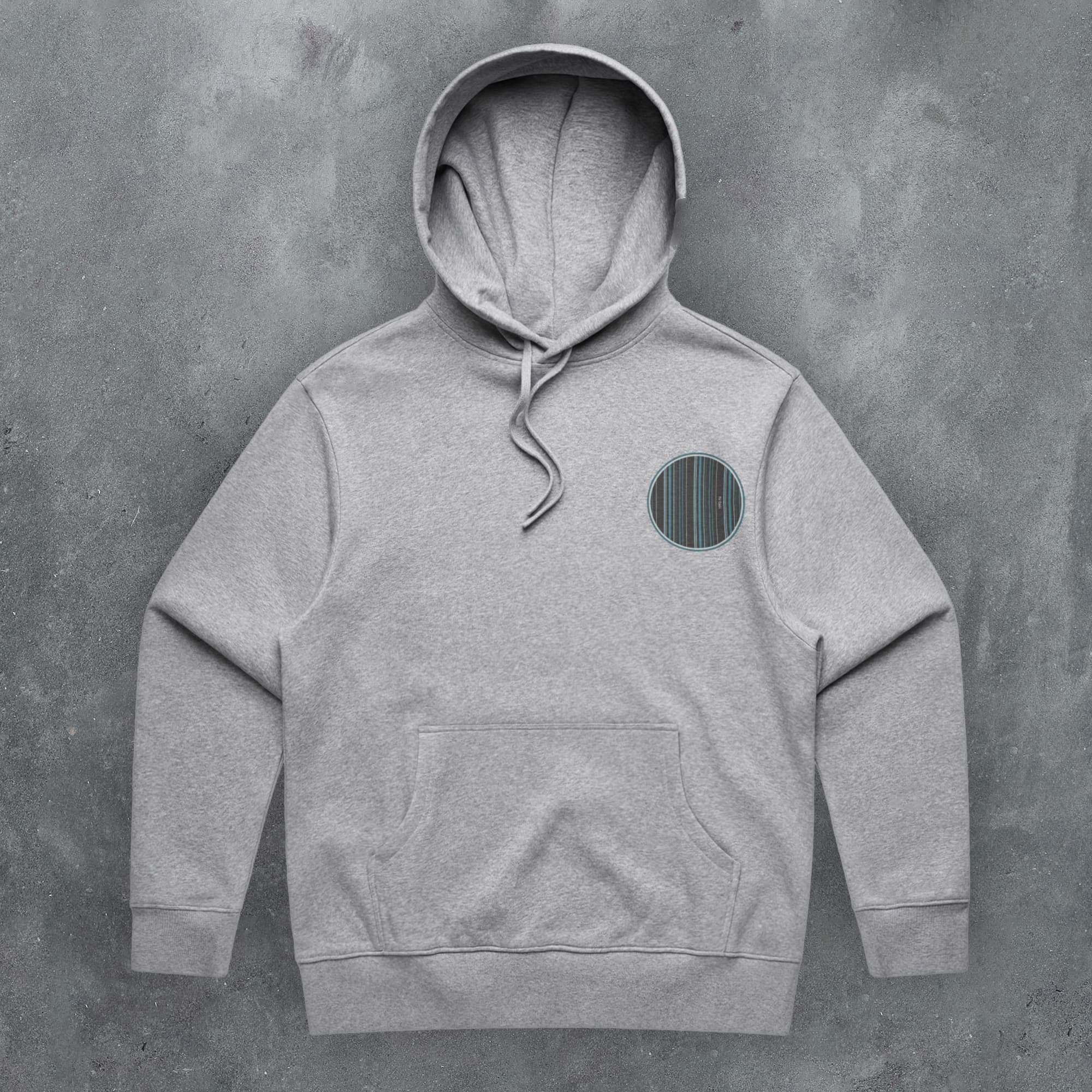 a grey hoodie with a green circle on the front