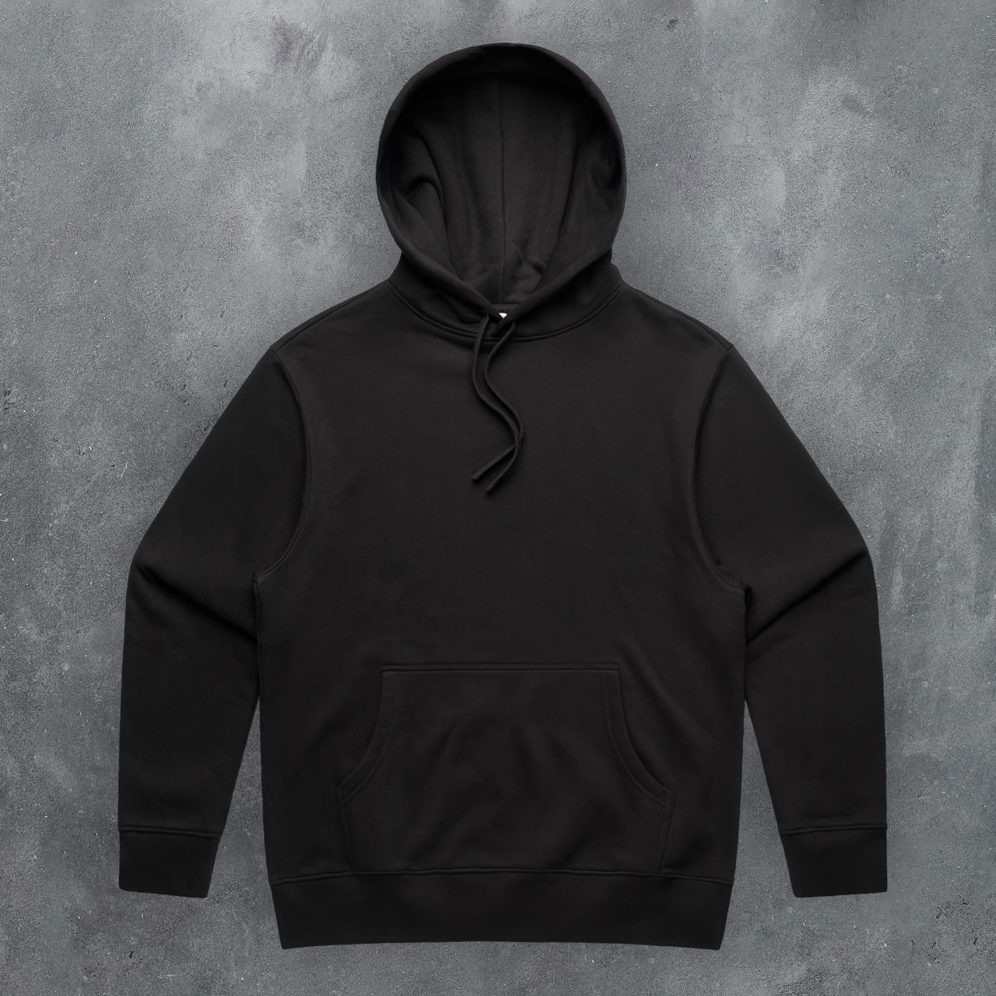 a black hoodie on a concrete background