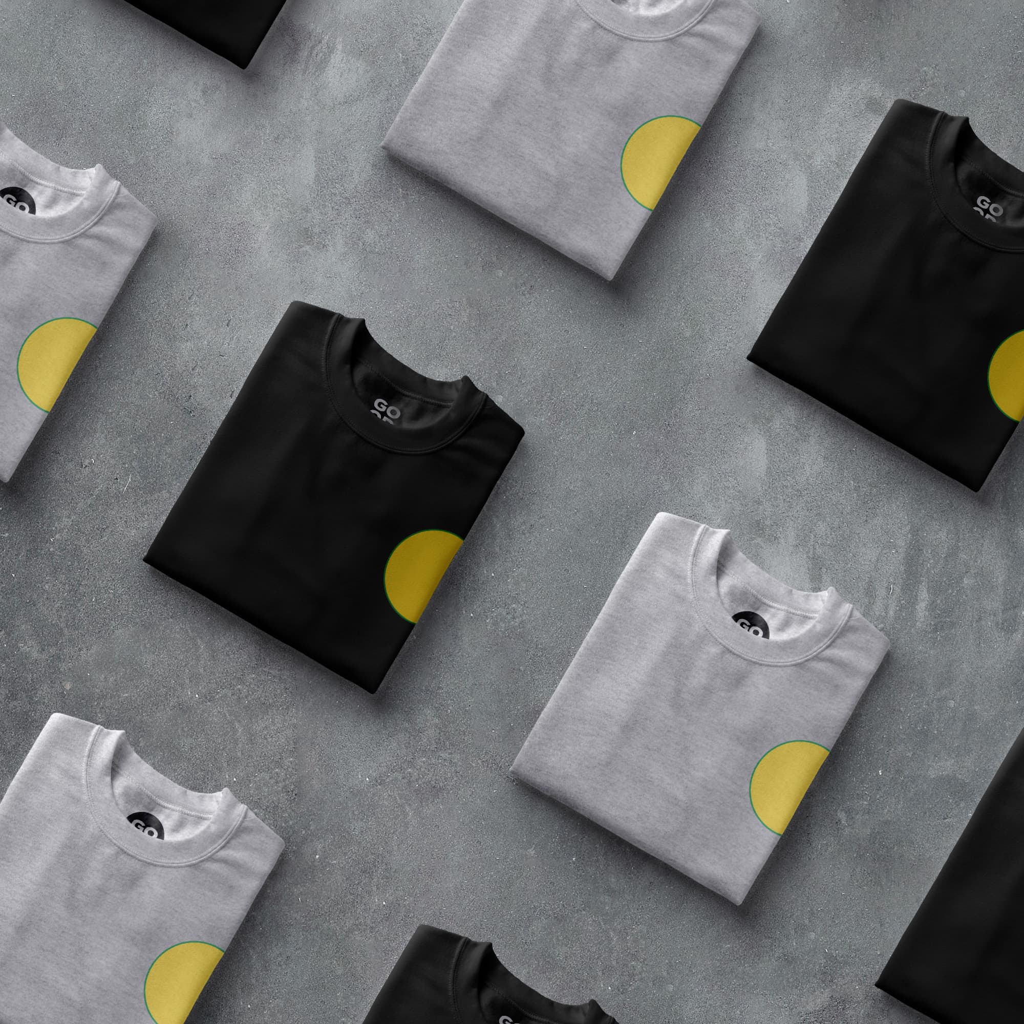 a group of black and white shirts with yellow circles on them