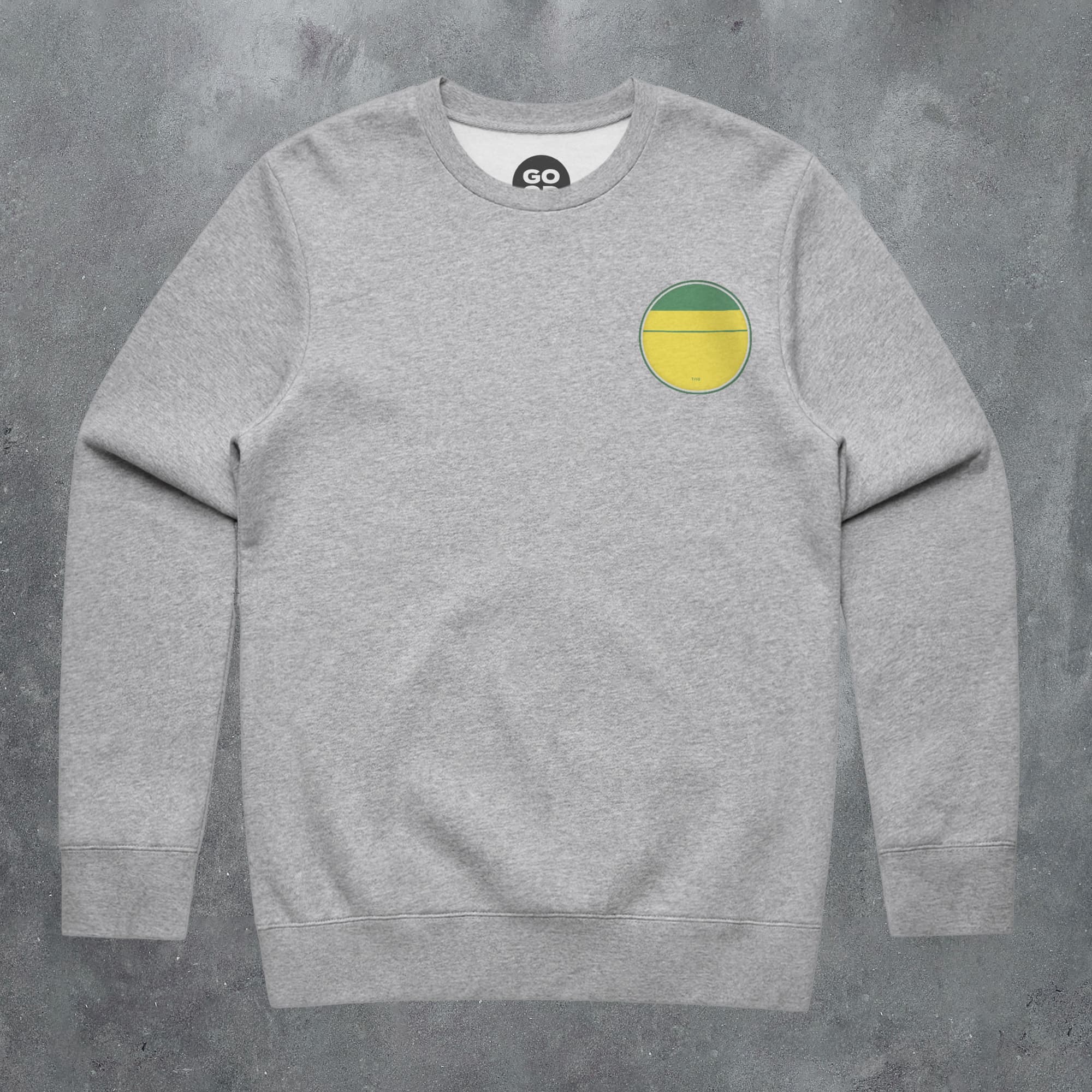a grey sweatshirt with a yellow and green circle on it