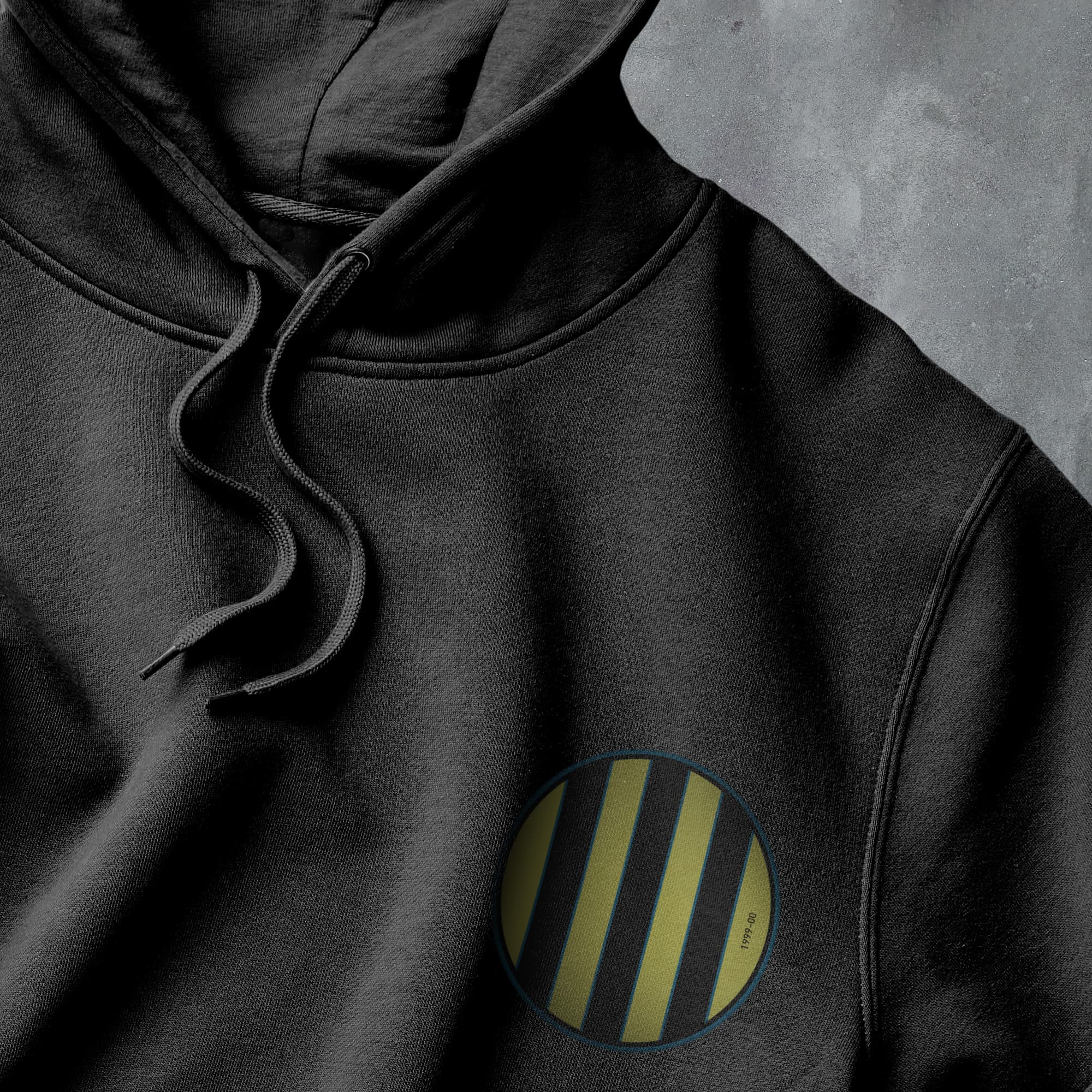 a black hoodie with a yellow and black stripe on it