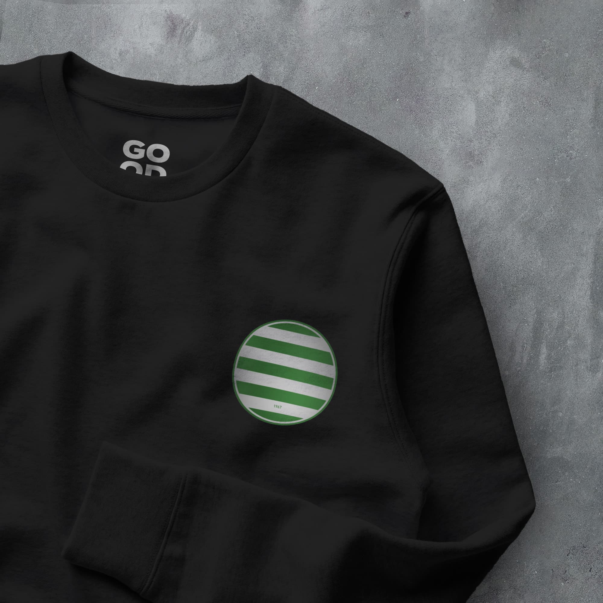 a black sweatshirt with a green and white striped pocket