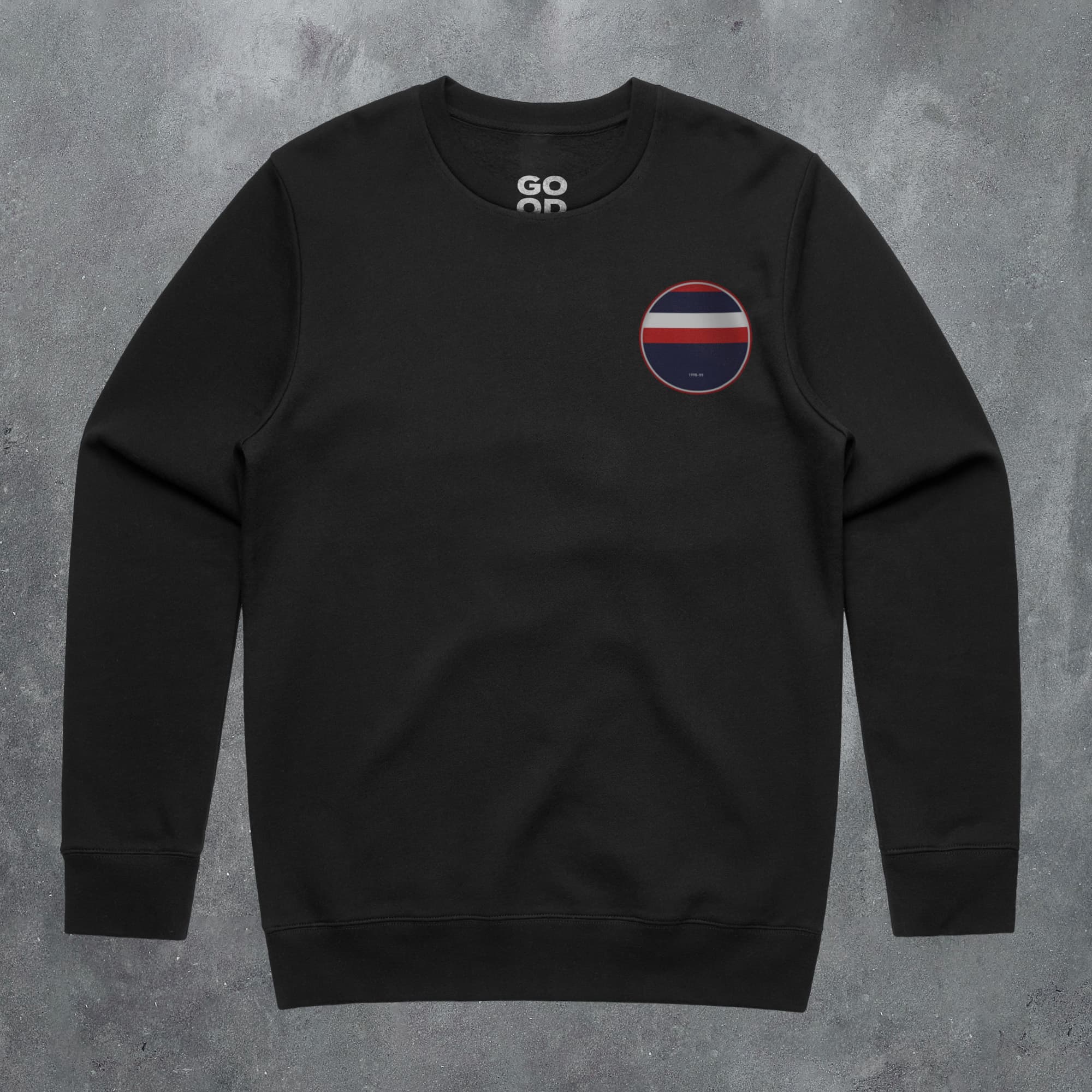 a black sweatshirt with a red, white and blue circle on the chest