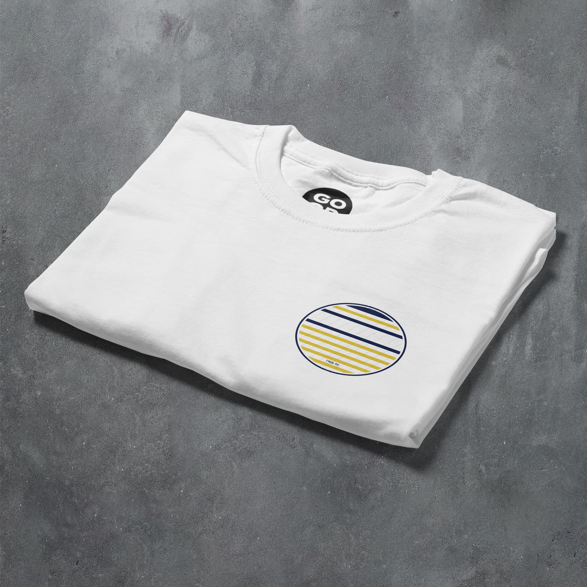 a white t - shirt with a striped circle on it