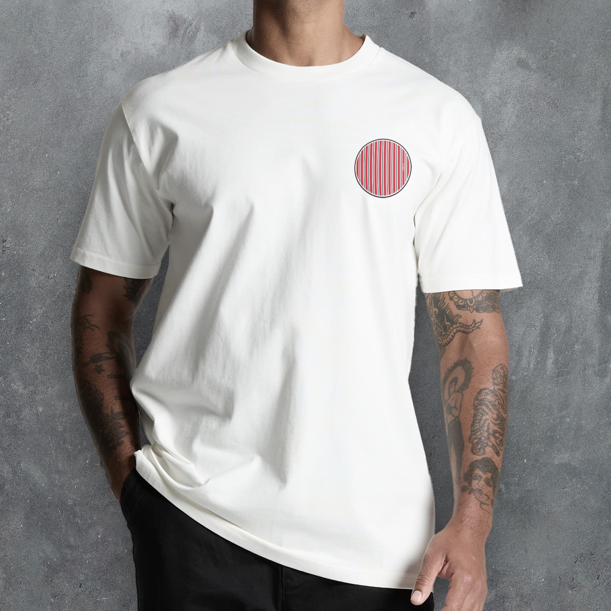 a man wearing a white t - shirt with a red circle on it