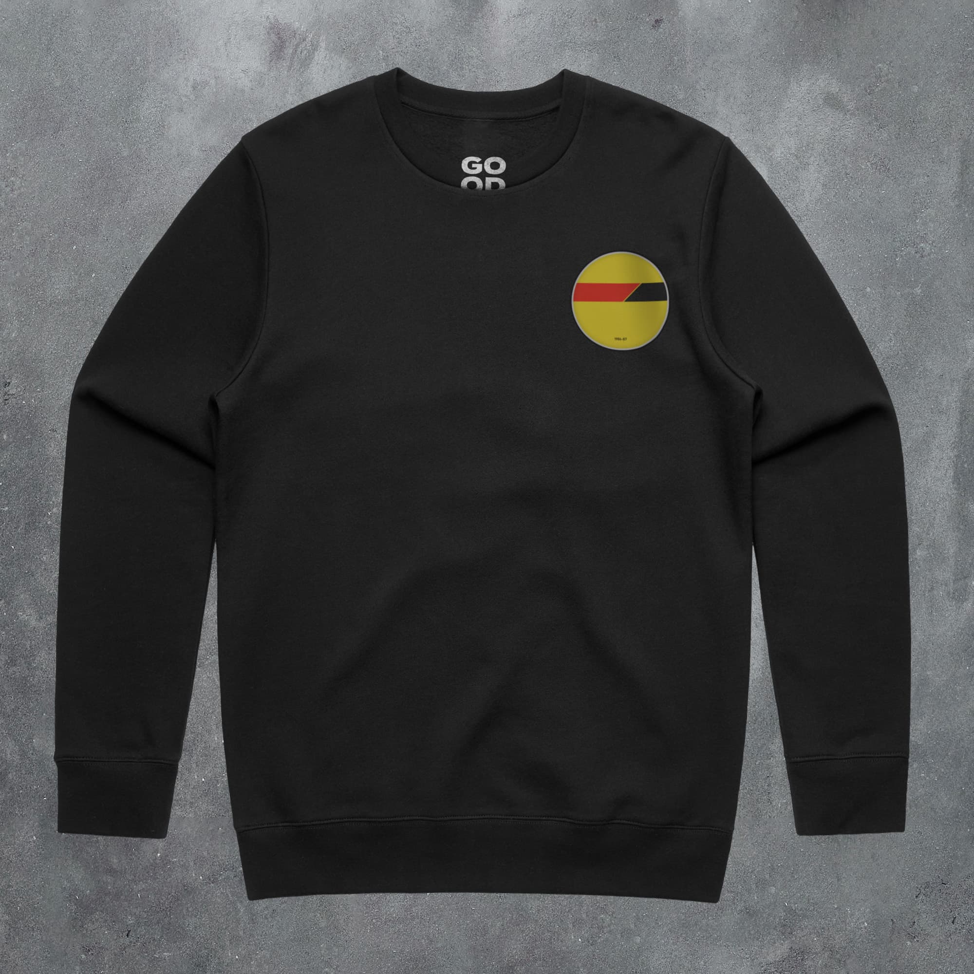 a black sweatshirt with a yellow and red circle on it