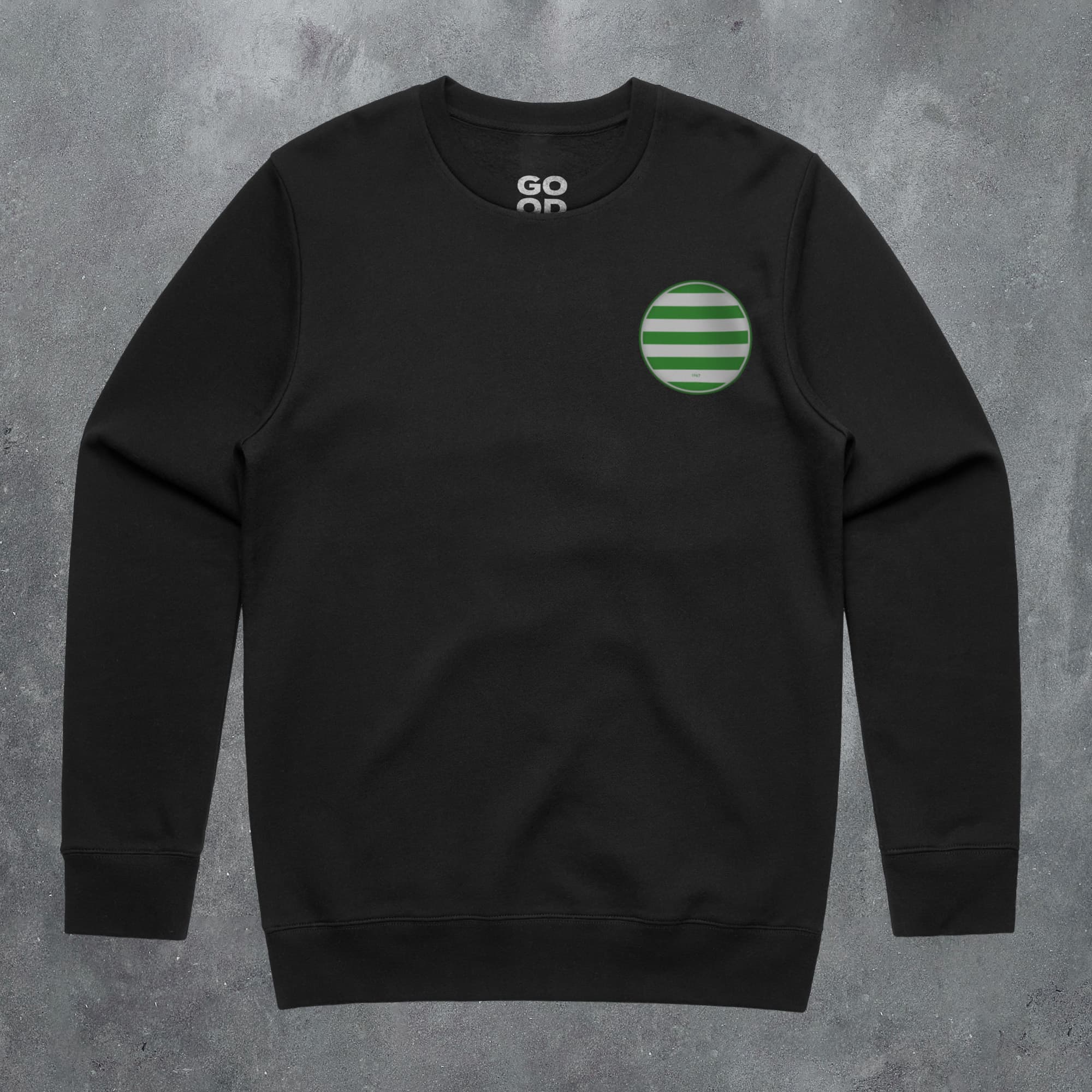 a black sweatshirt with a green circle on the front