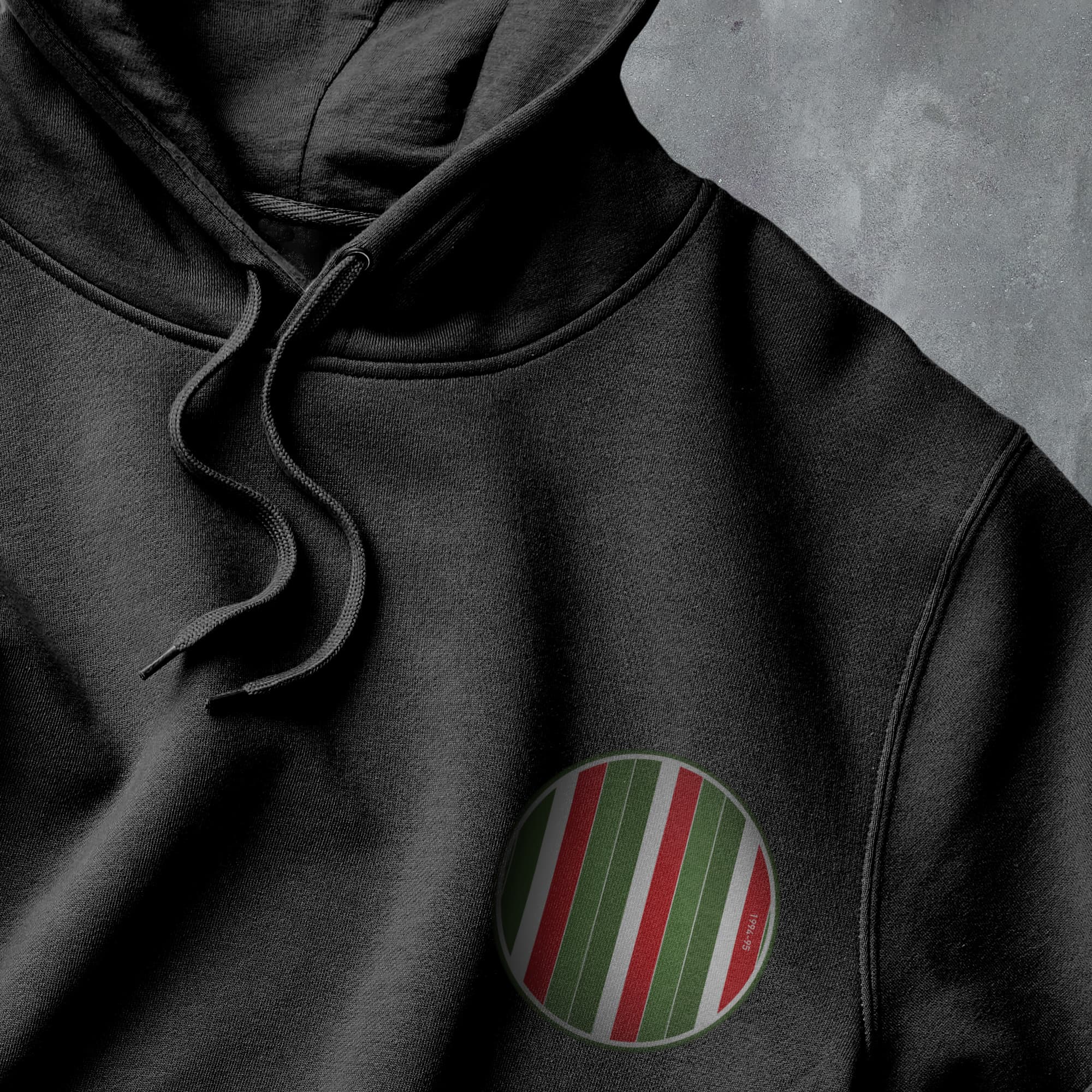 a black hoodie with a red, green and white stripe on it