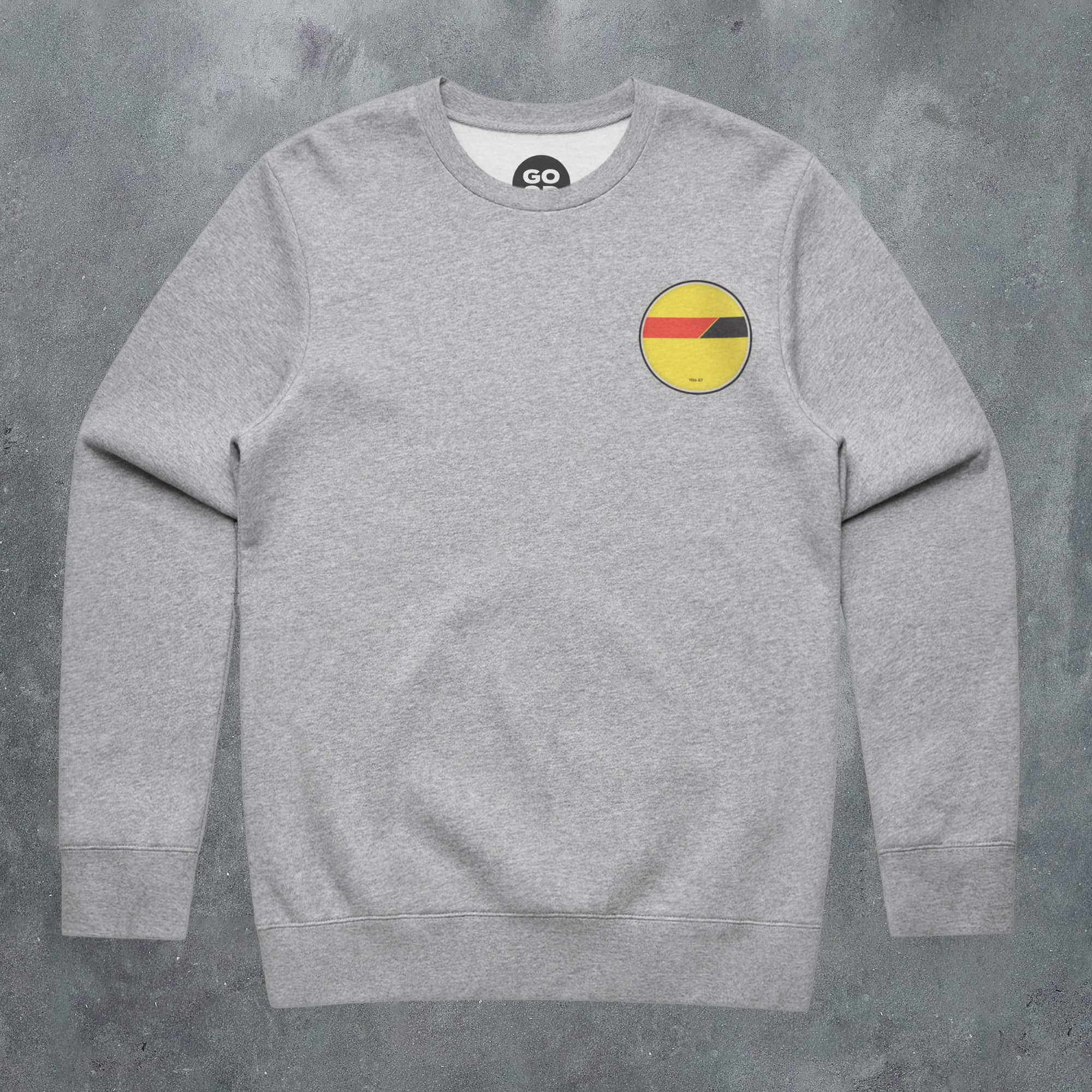a grey sweatshirt with a yellow and red smiley face on it