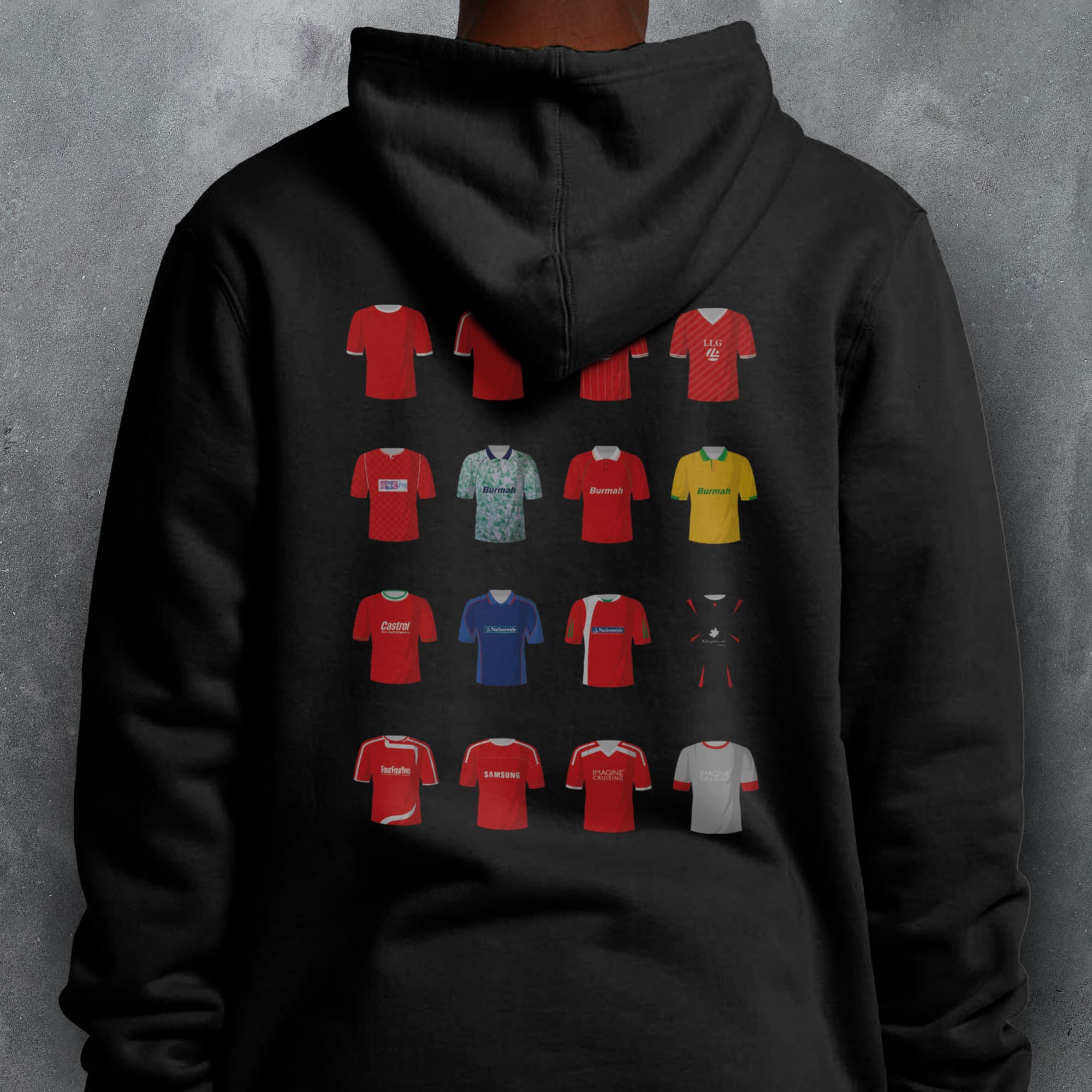 a person wearing a black hoodie with a bunch of different colored shirts on it