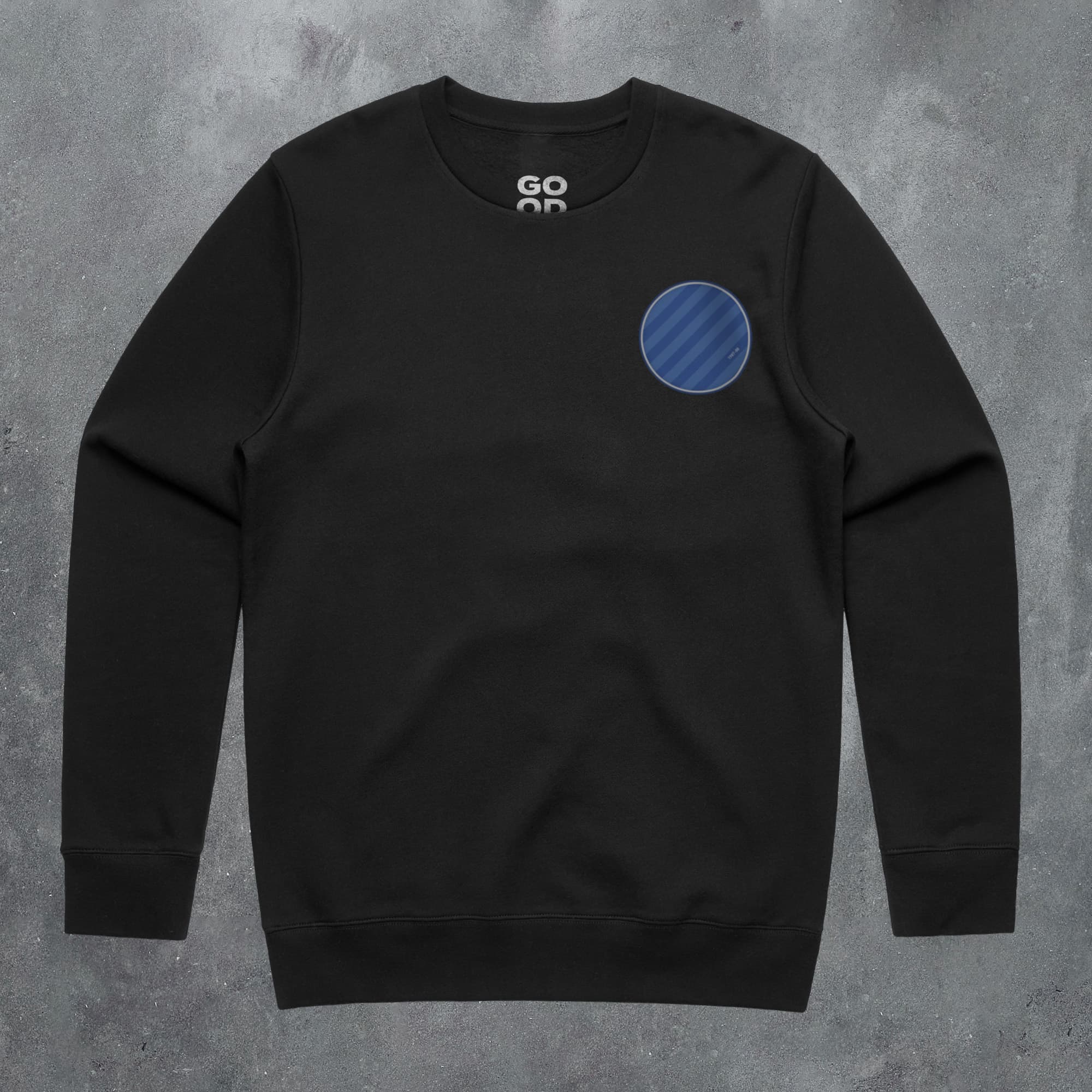 a black sweatshirt with a blue circle on it