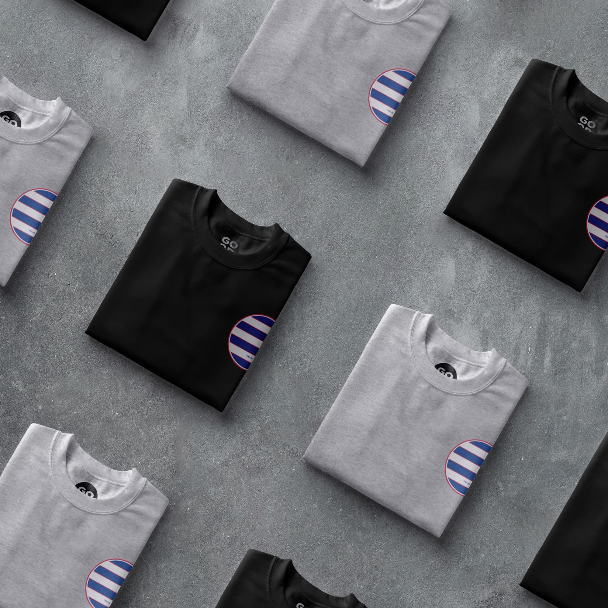 a group of black and white shirts with blue and white stripes