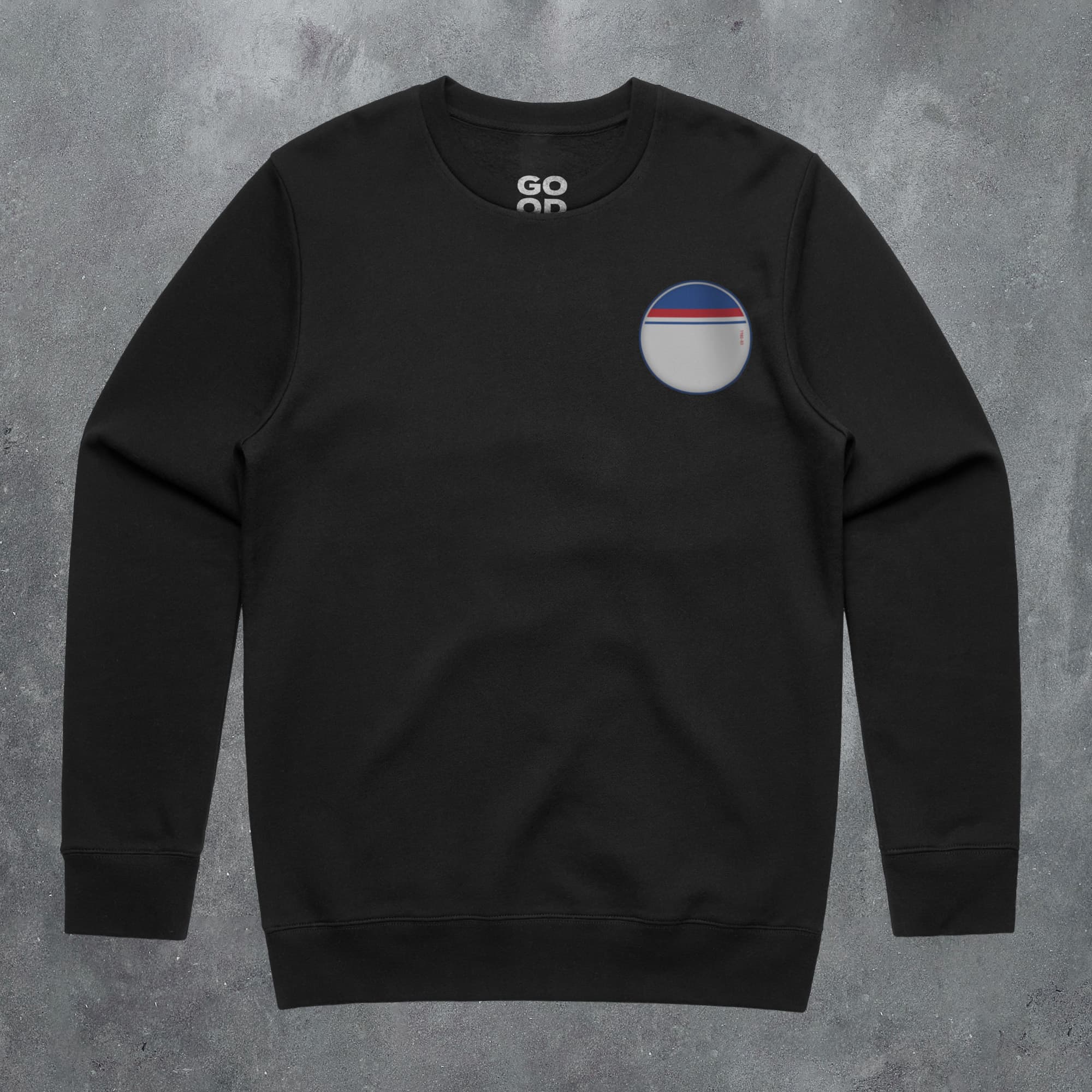 a black sweatshirt with a round logo on the chest