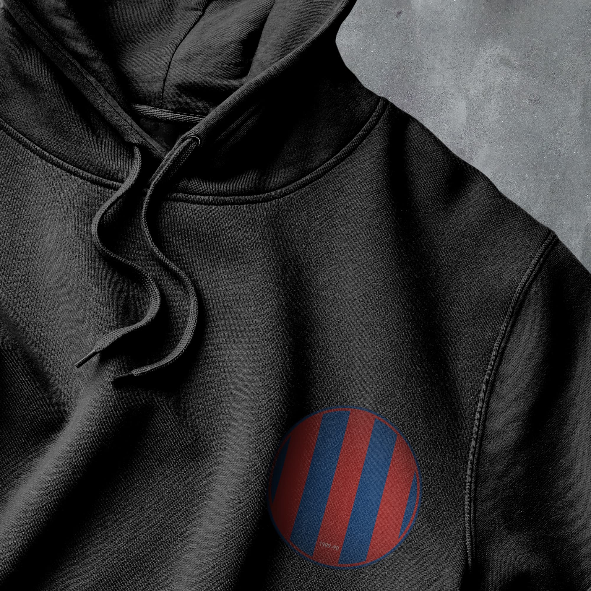 a black hoodie with a red and blue circle on it