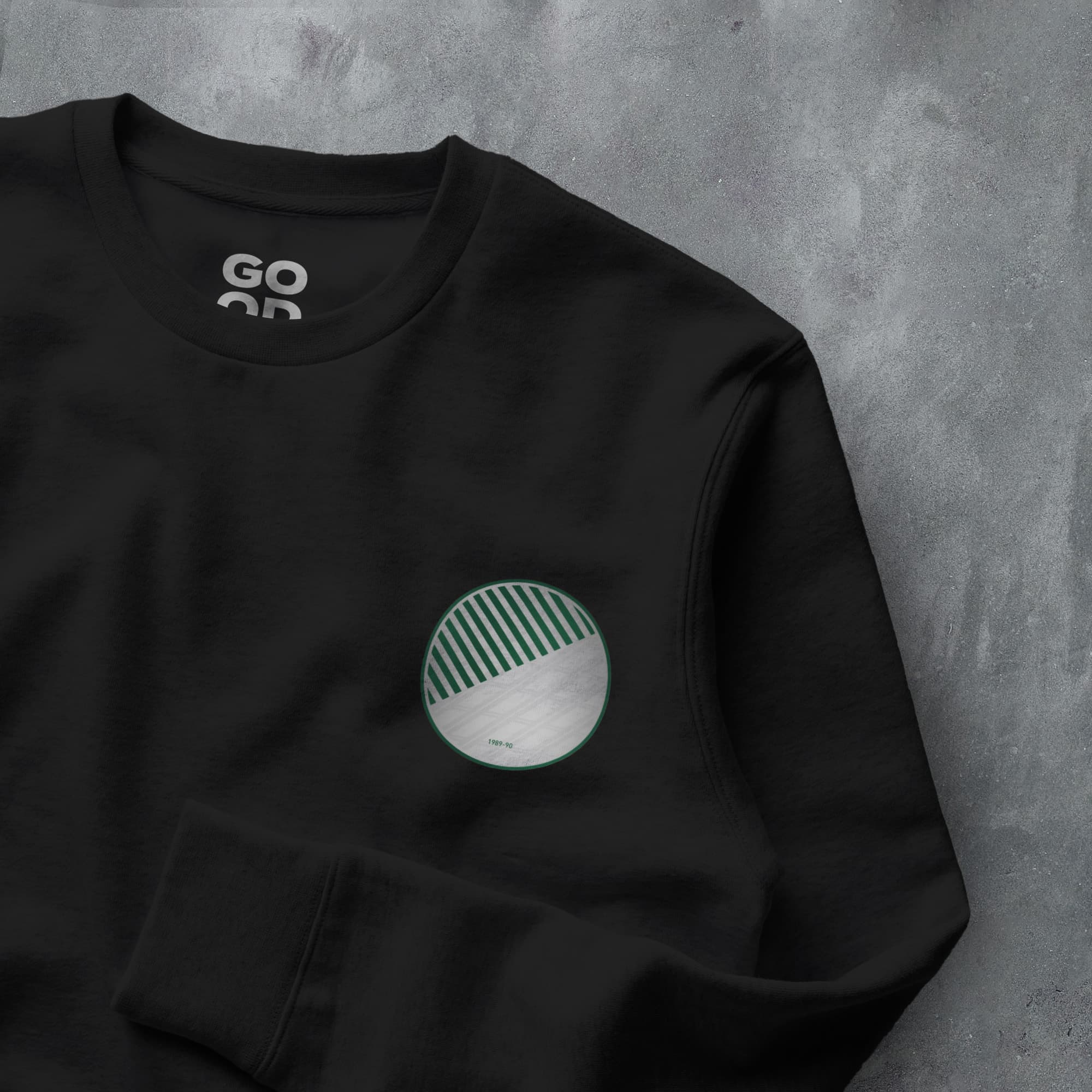 a black sweatshirt with a green and white logo
