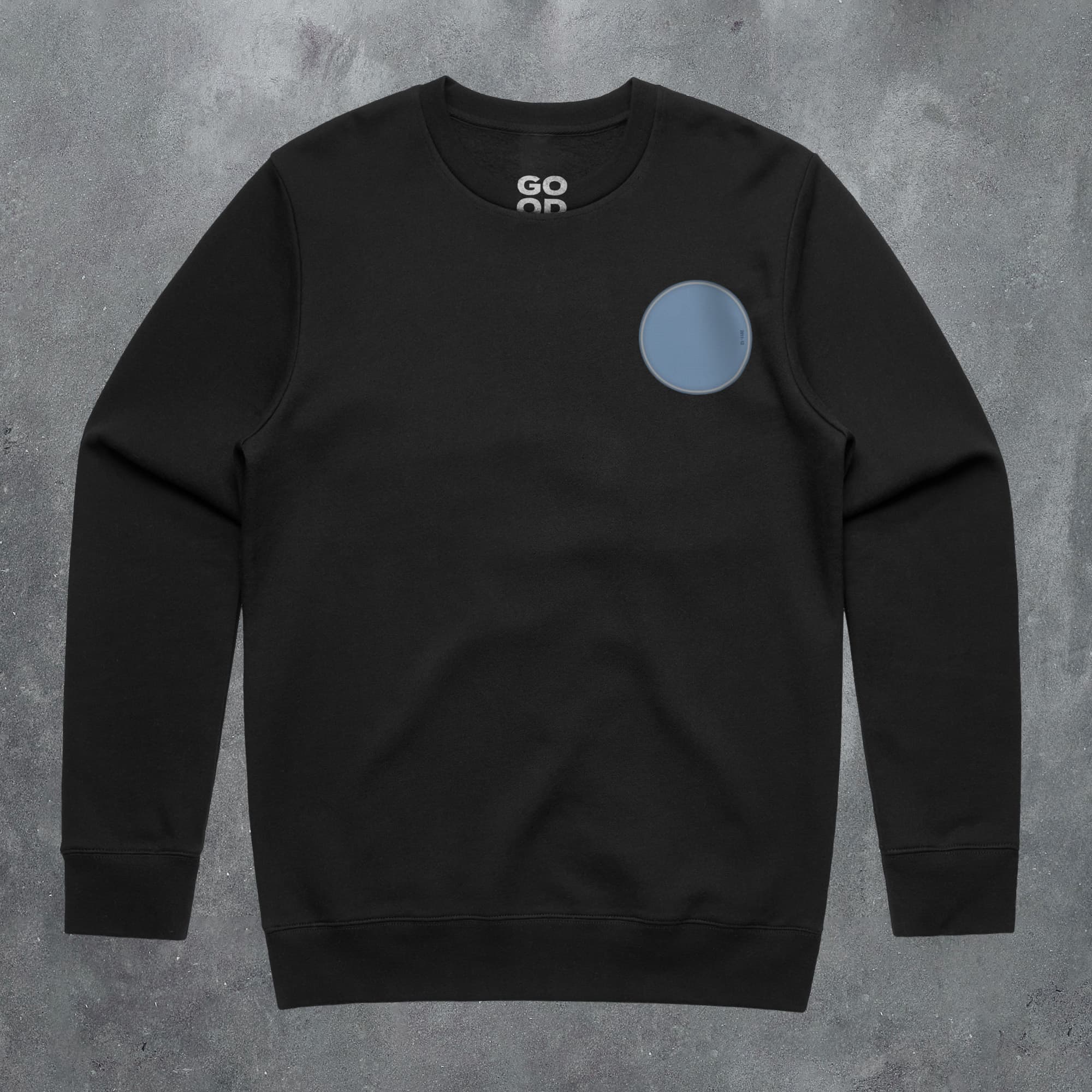 a black sweatshirt with a blue circle on it