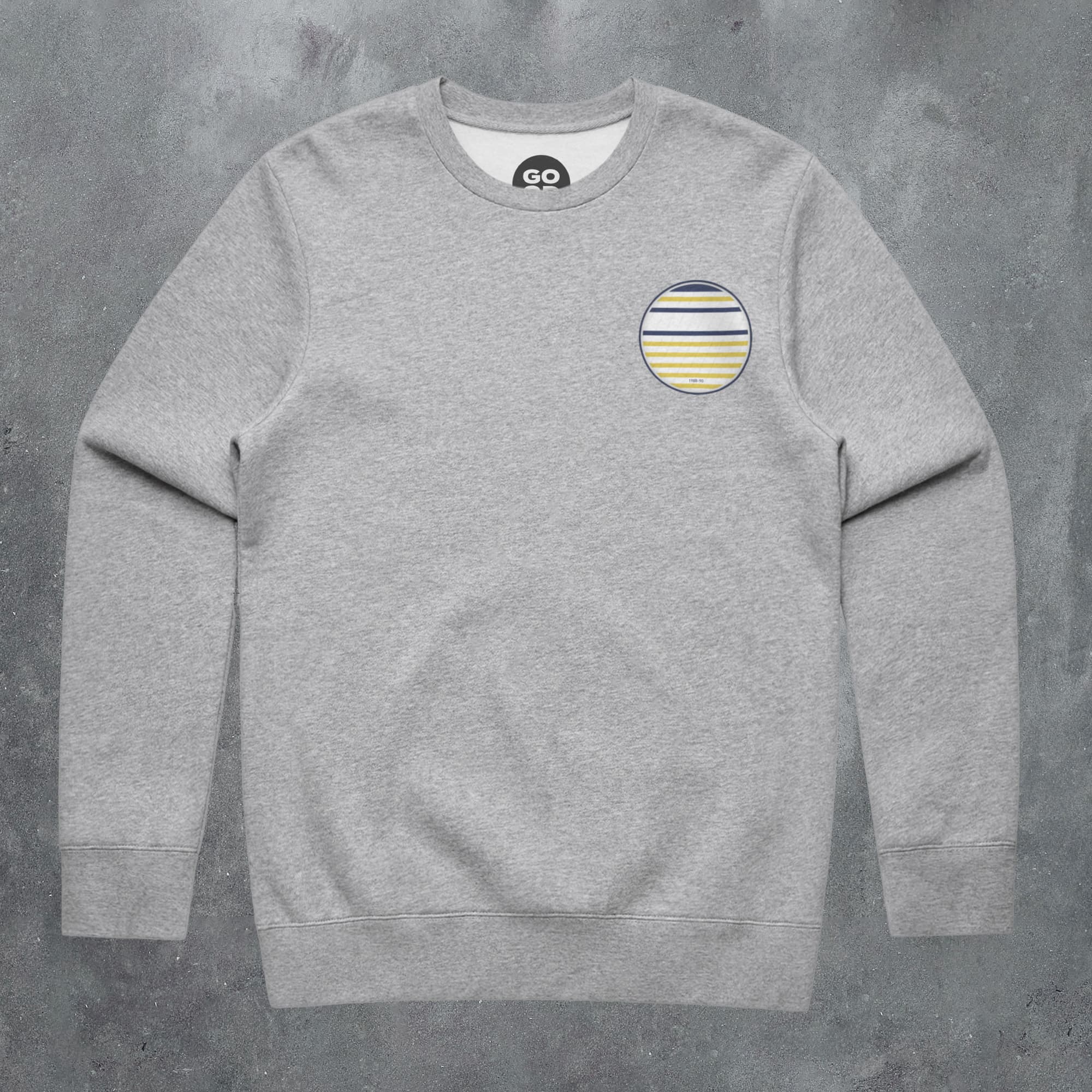 a grey sweatshirt with a striped circle on the chest