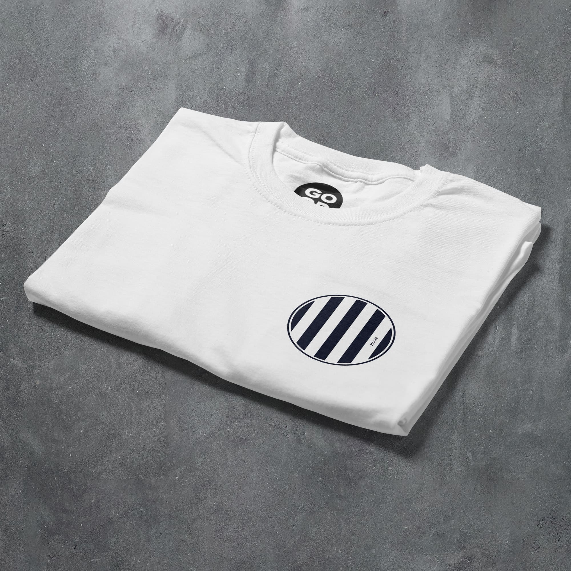 a white t - shirt with a black and white circle on it