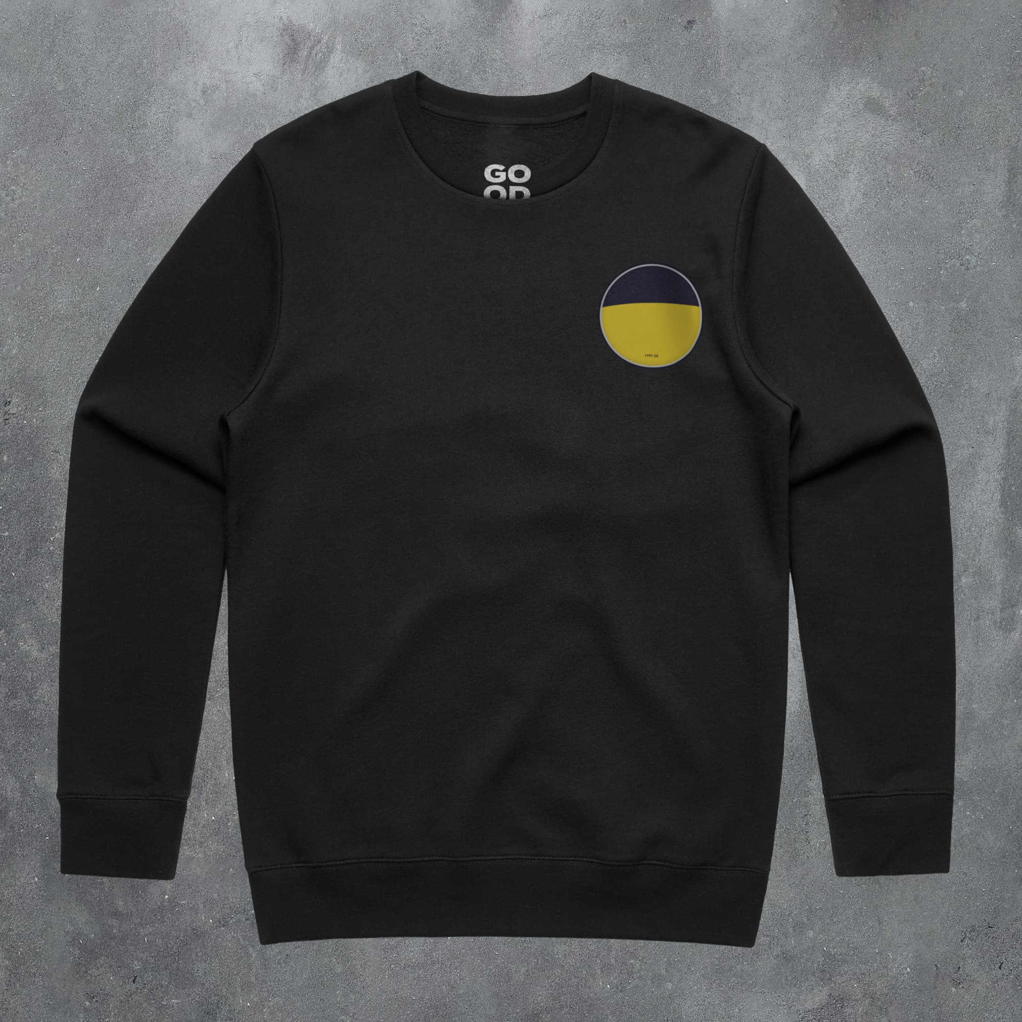 a black sweatshirt with a yellow circle on the chest