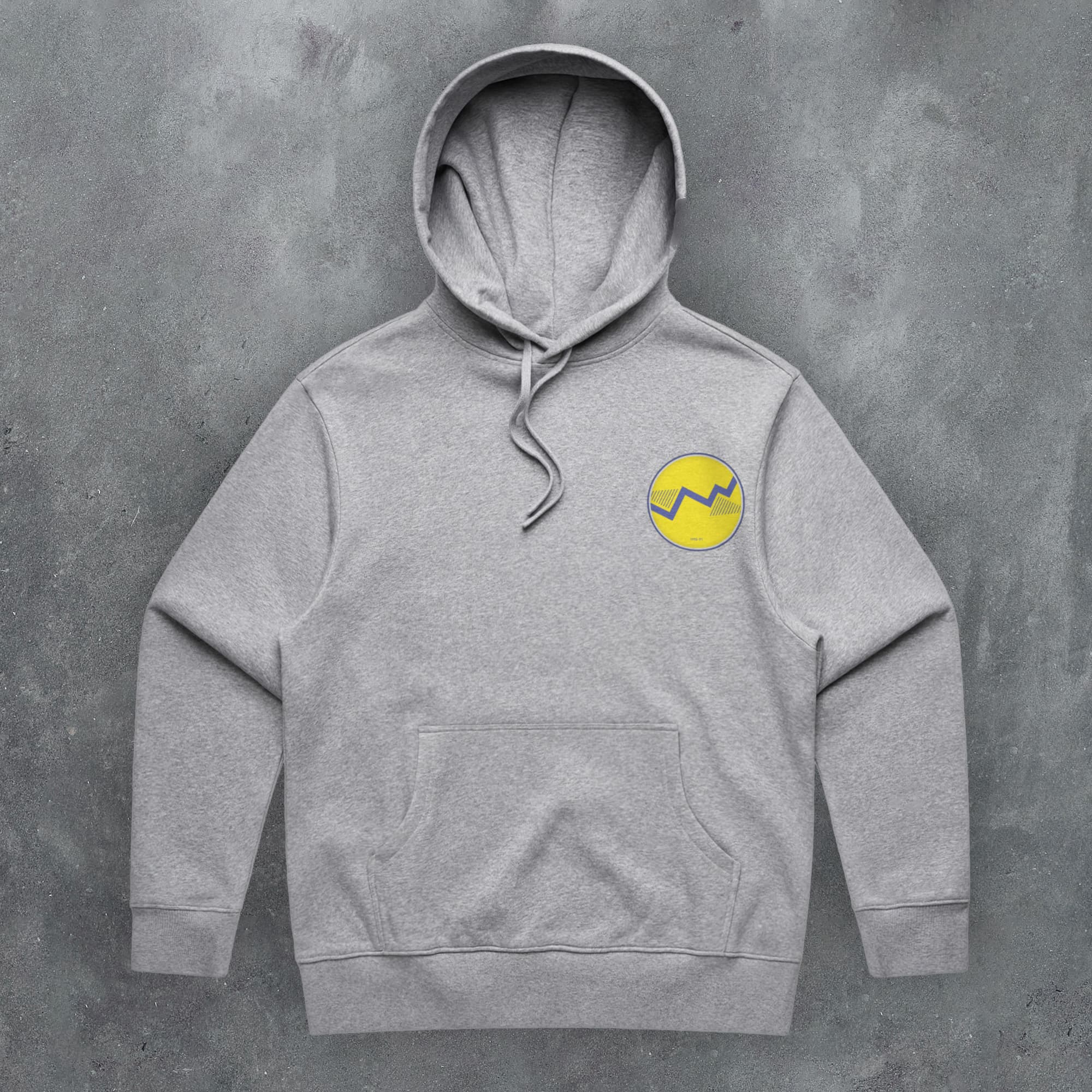 a grey sweatshirt with a yellow smiley face on it