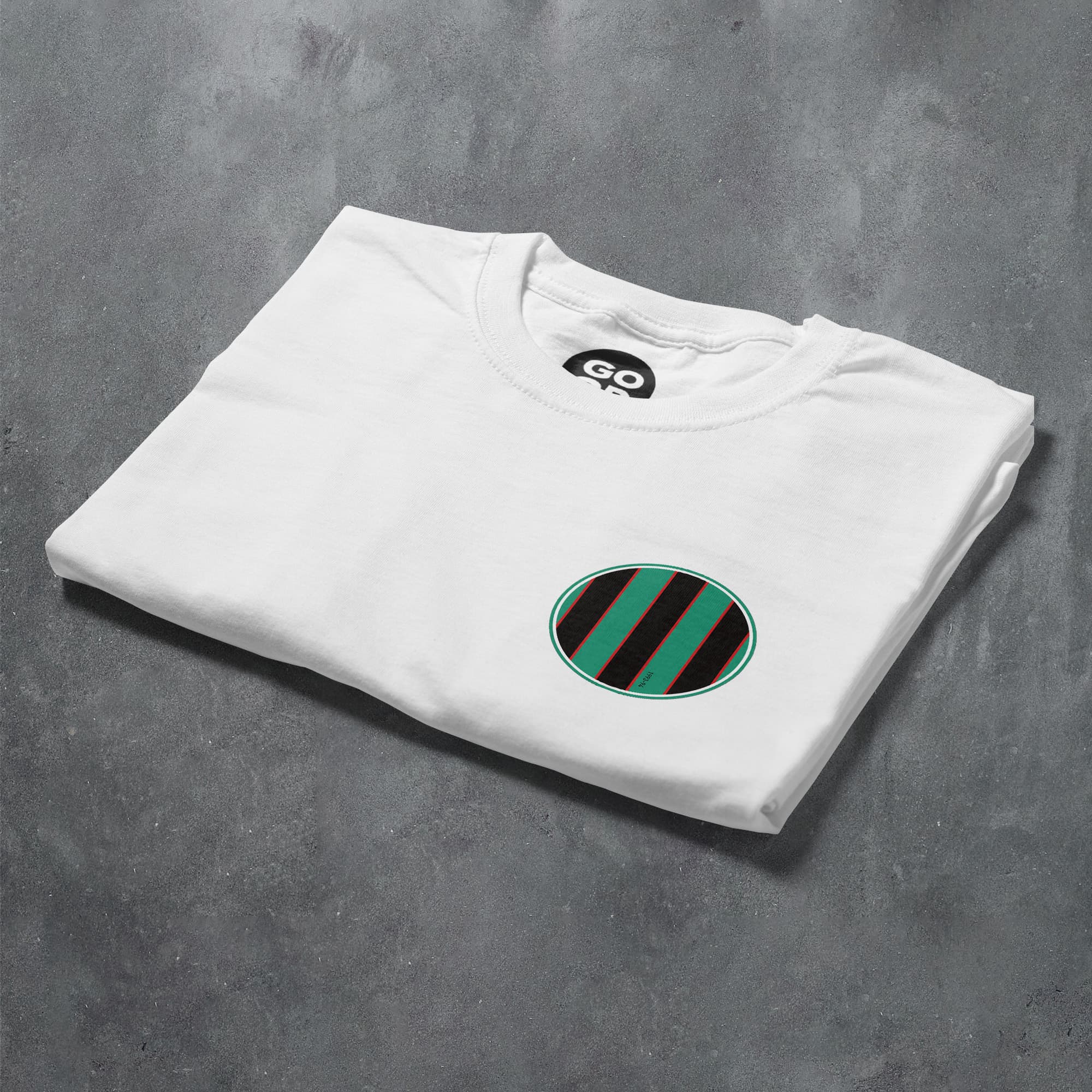 a white t - shirt with a black and green circle on the front