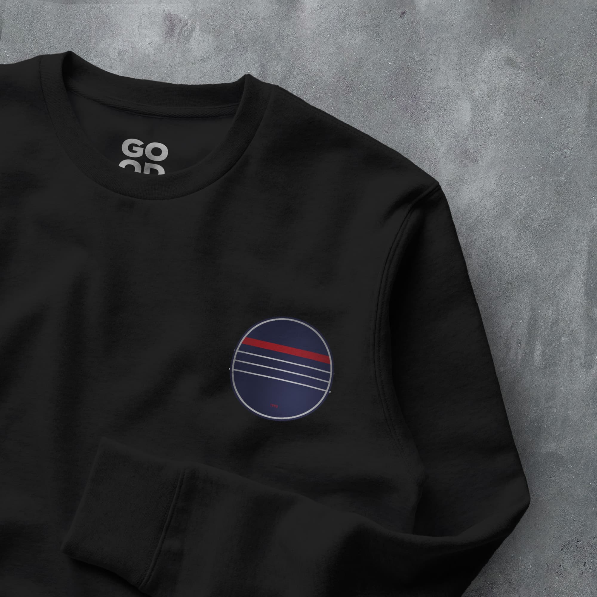 a black sweatshirt with a red, white and blue circle on it
