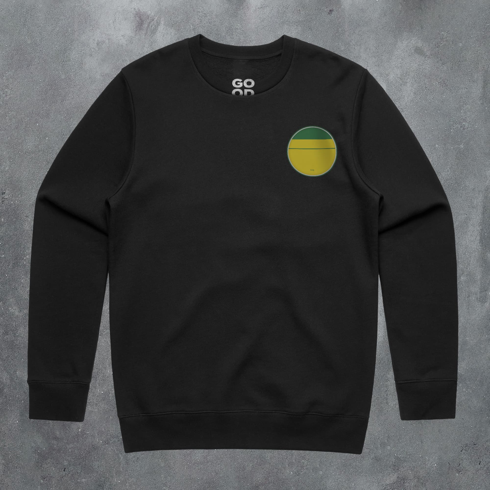 a black sweatshirt with a green and yellow circle on it