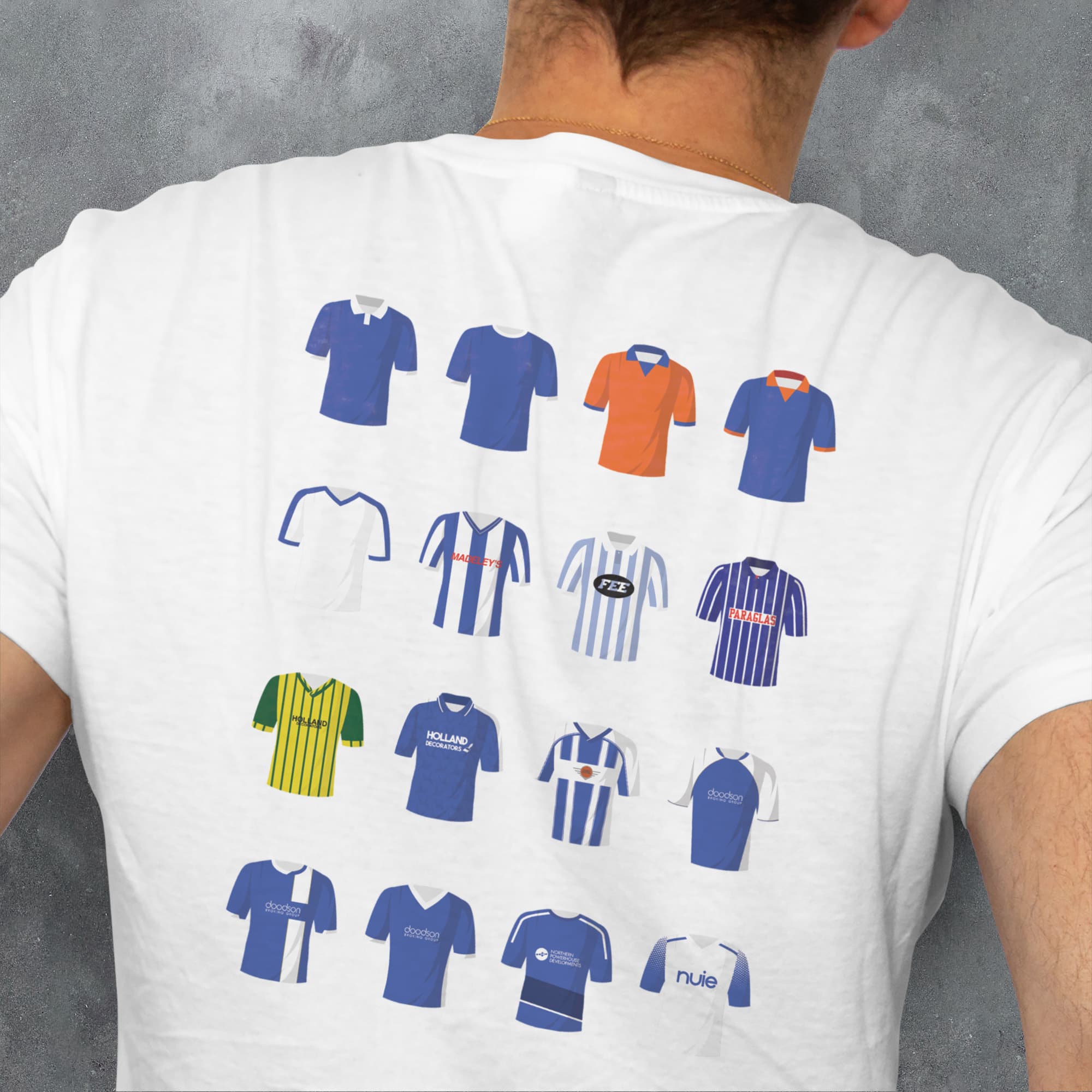 a man wearing a t - shirt with a bunch of different shirts on it